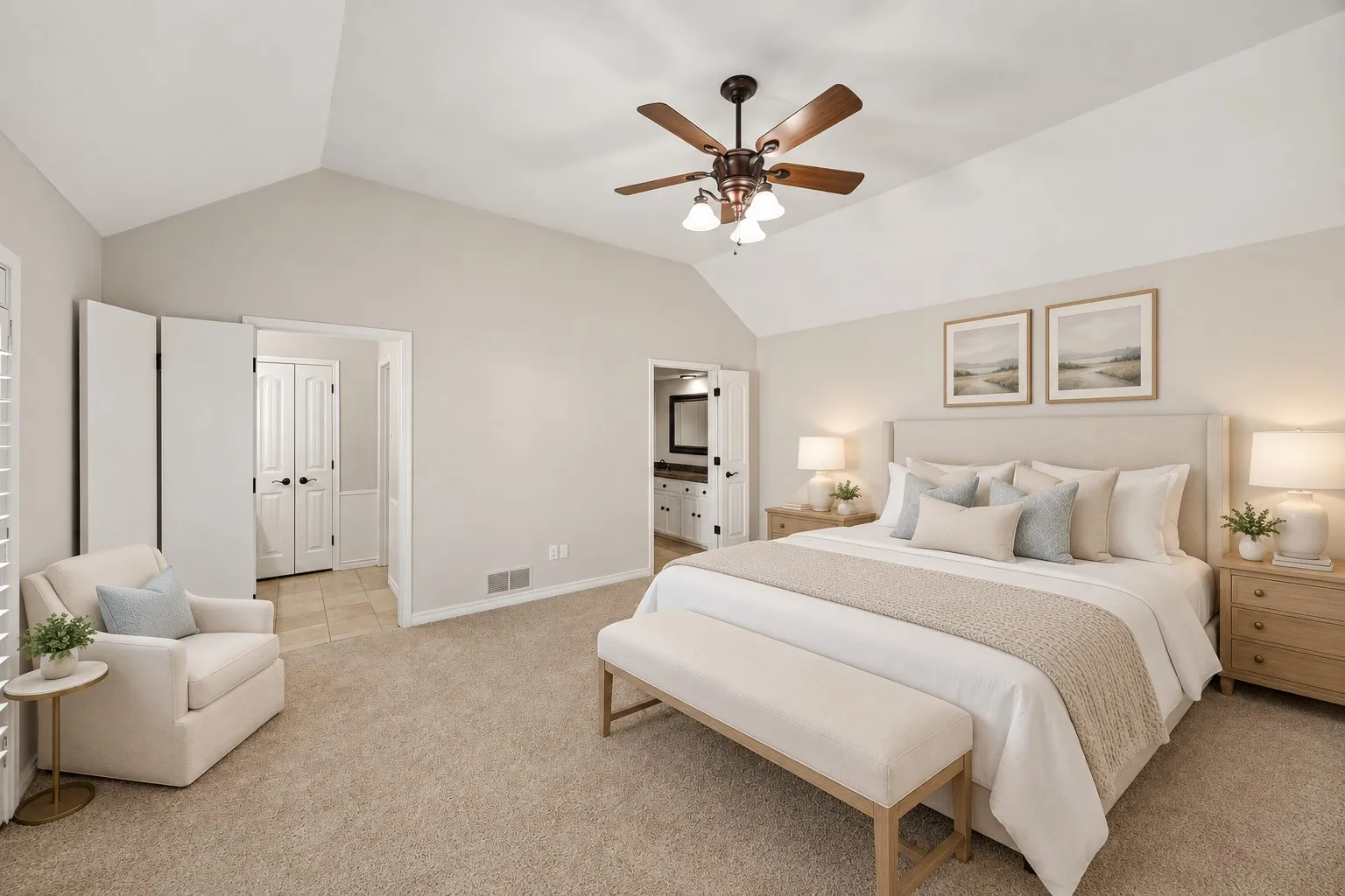 Spacious primary bedroom featuring vaulted ceilings, neutral wall finishes, and new carpet. Ensuite bath with separate vanities and separate closets. This photo is virtually staged.