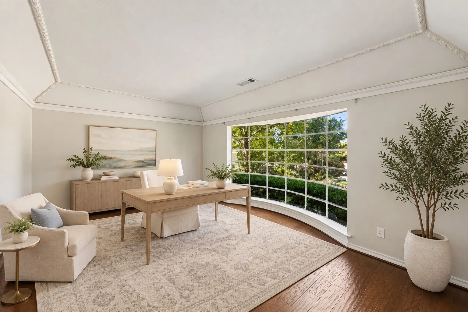 Front living room which can serve as an in-home office, featuring hardwoods, bay window, and lots of natural light. This photo is virtually staged.