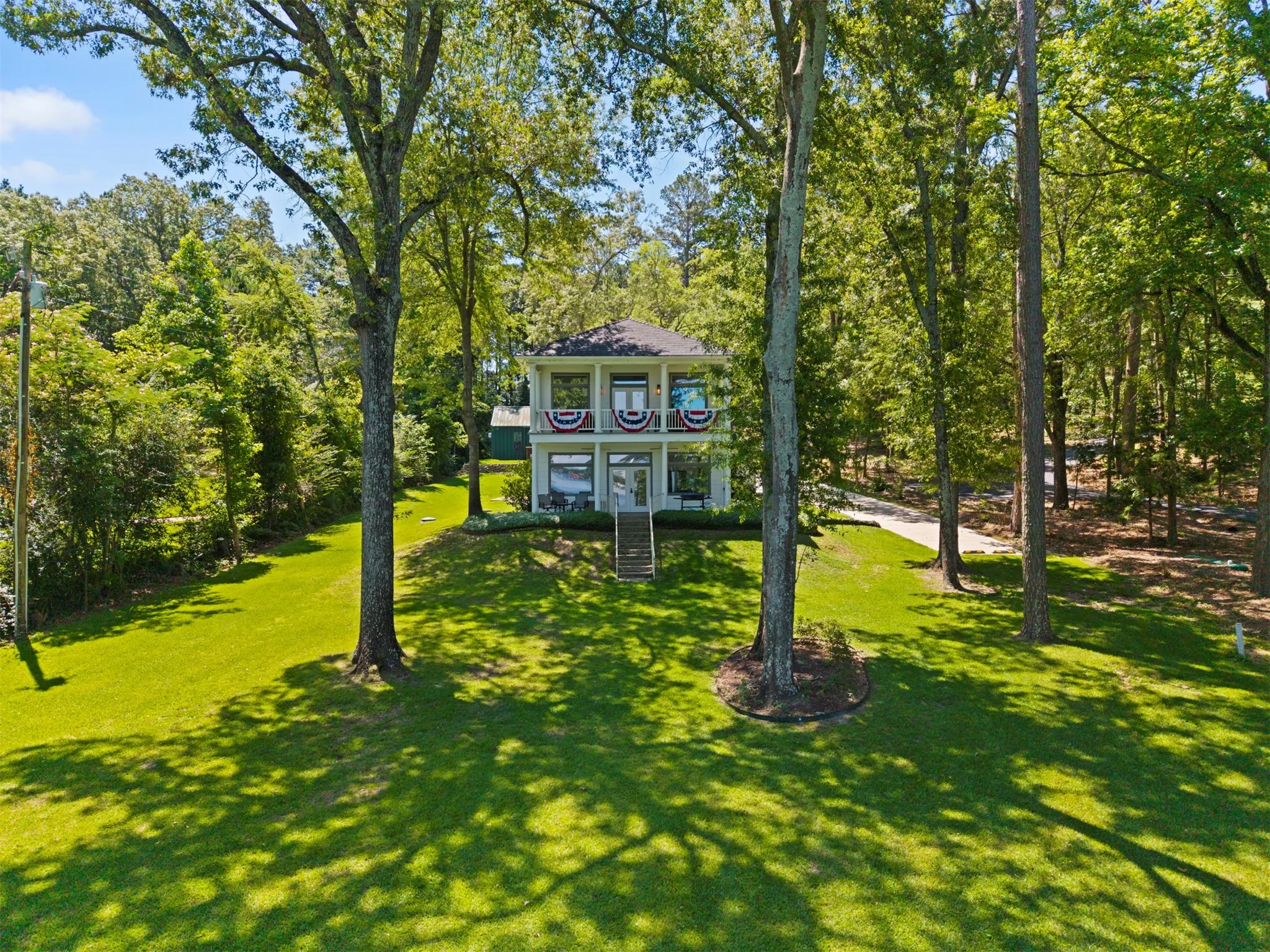 Two-story residence with a prominent gabled roof and multiple windows
