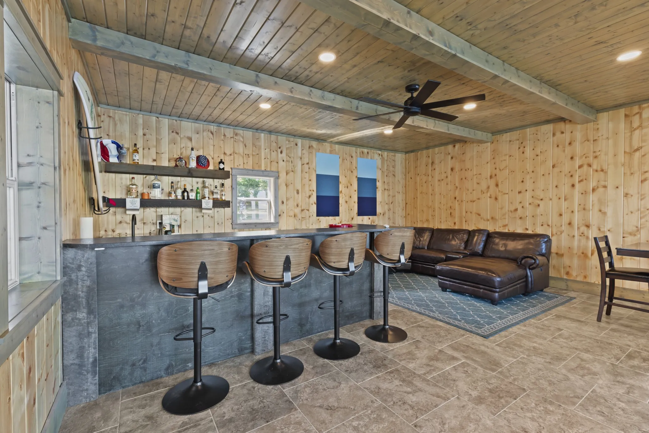 Wood-paneled walls and ceiling with exposed beams