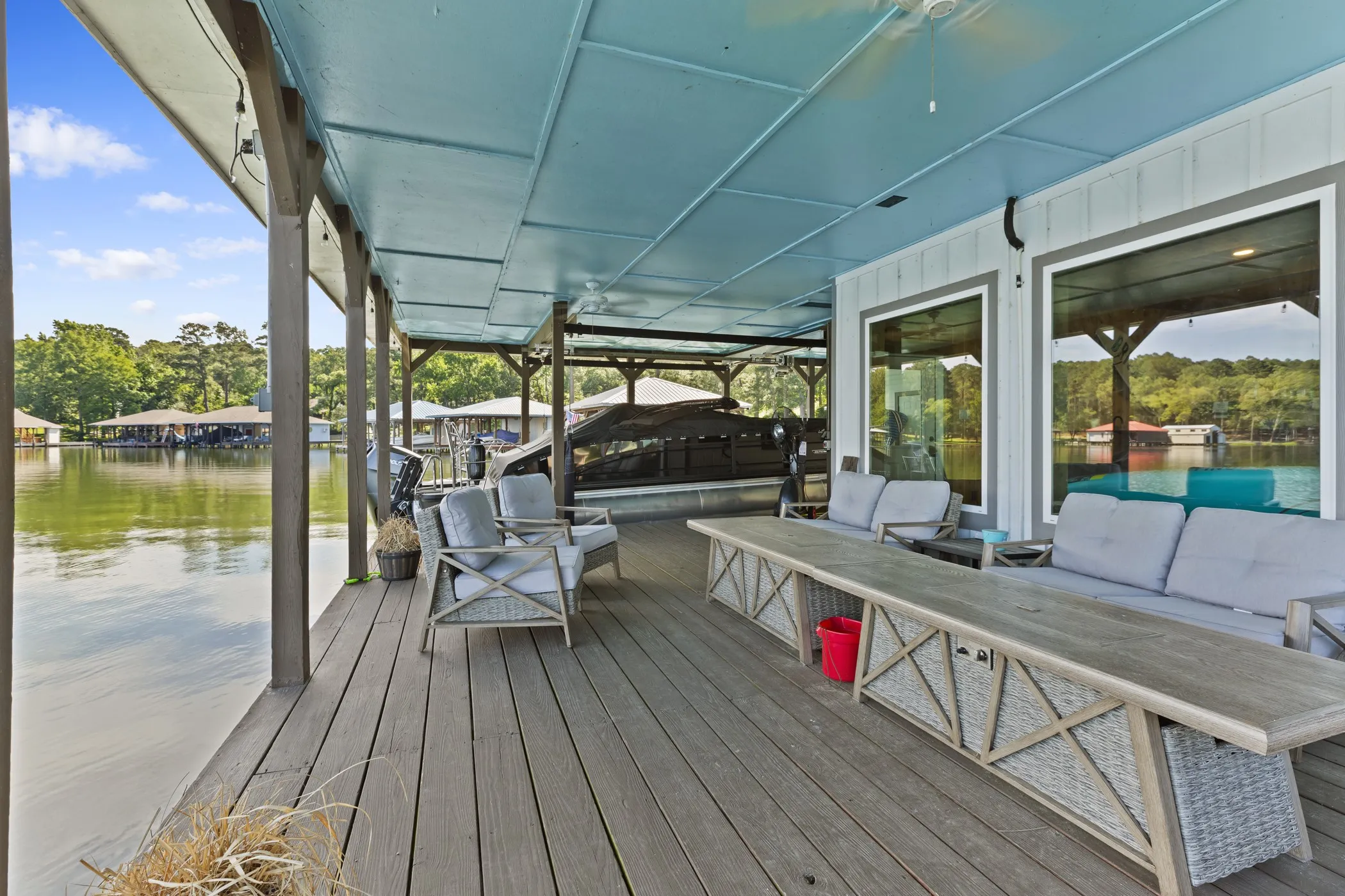 Expansive covered dock with wood-finish decking and integrated boat slips