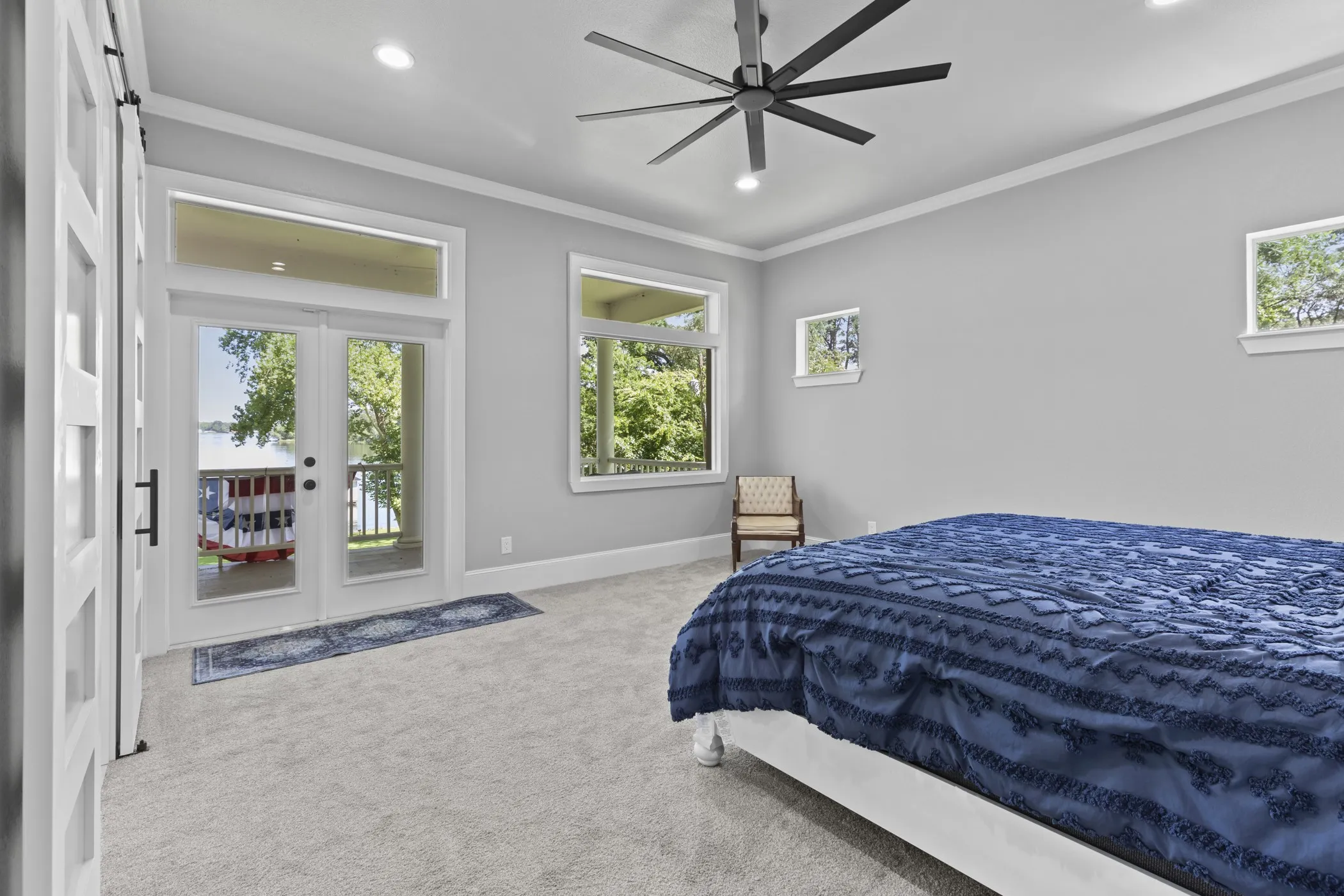 French doors with transom window, ceiling fan with integrated lighting, recessed lighting, and crown molding