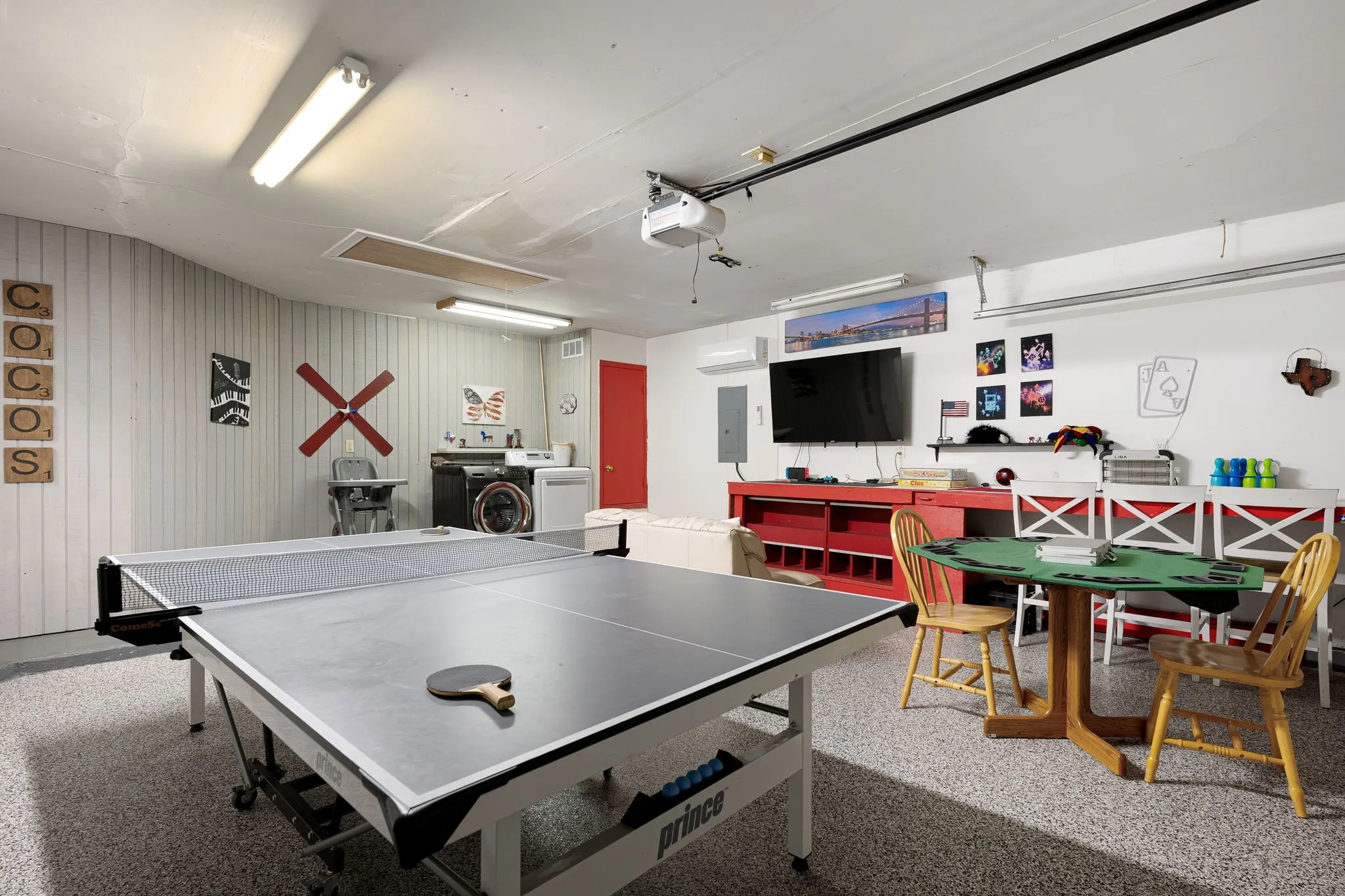 Garage has epoxy flooring, 220v powerline, and can be used as play space or garage space.