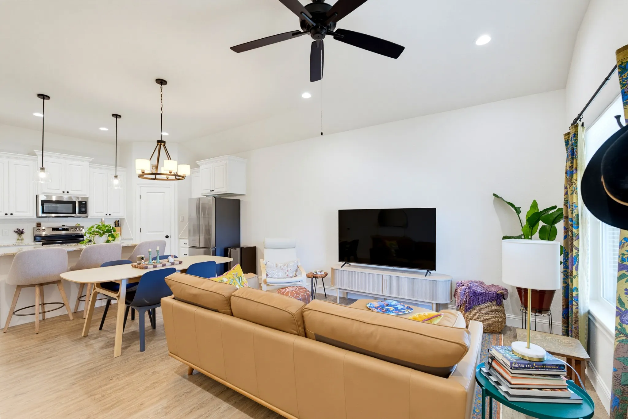 Open-concept living space with wood-finish flooring