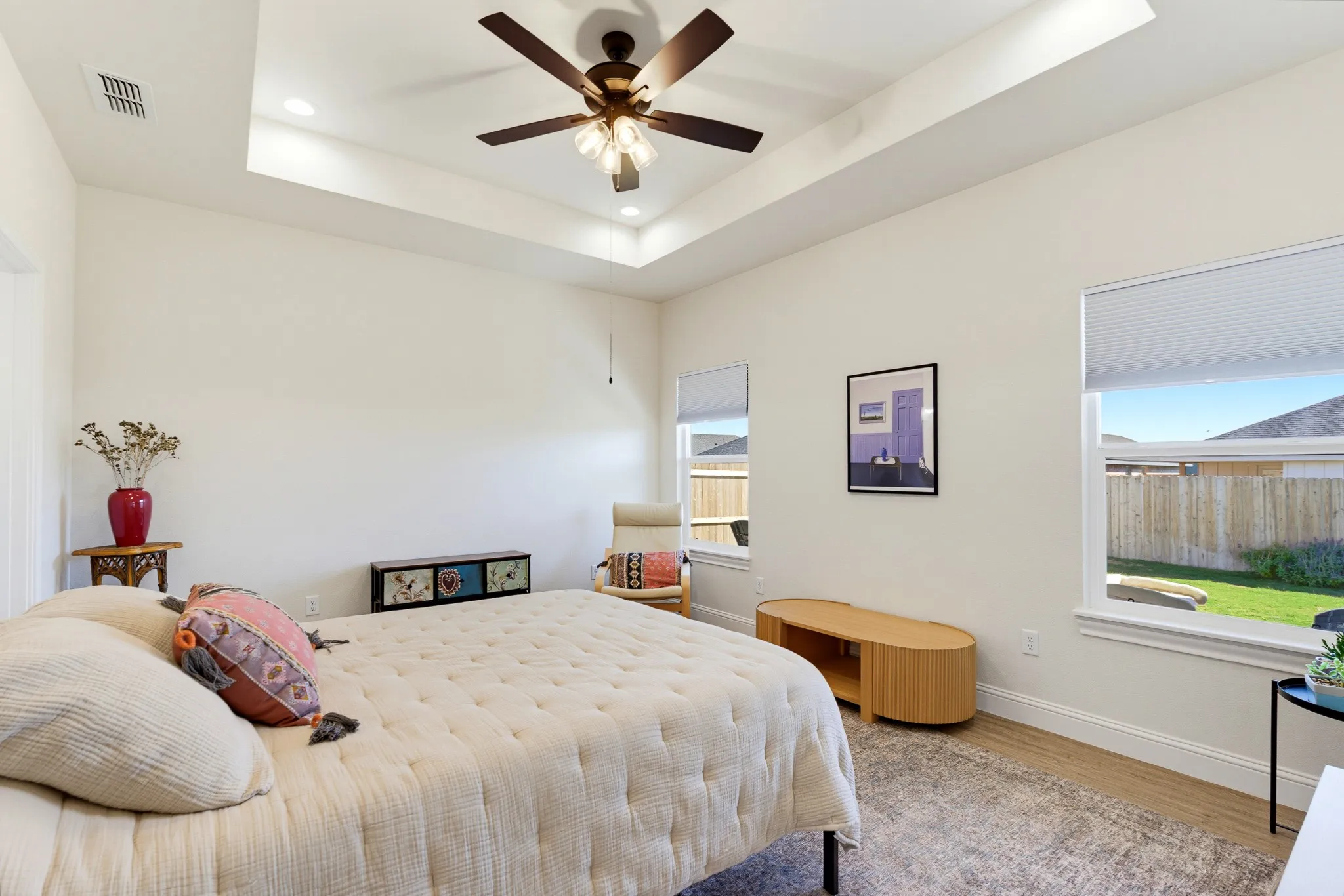 Tray ceiling with recessed lighting and a ceiling fan