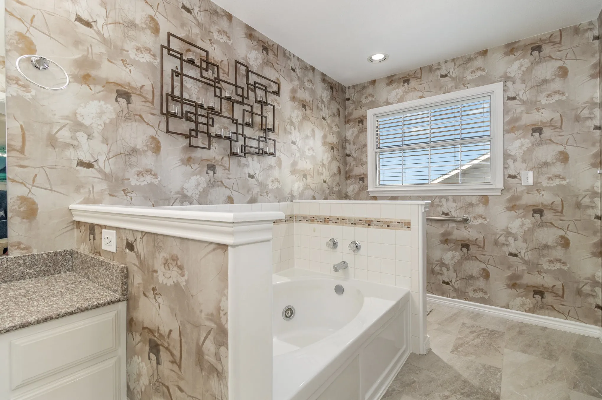Jetted garden tub in primary bath, recessed LED lighting to complement the natural light.