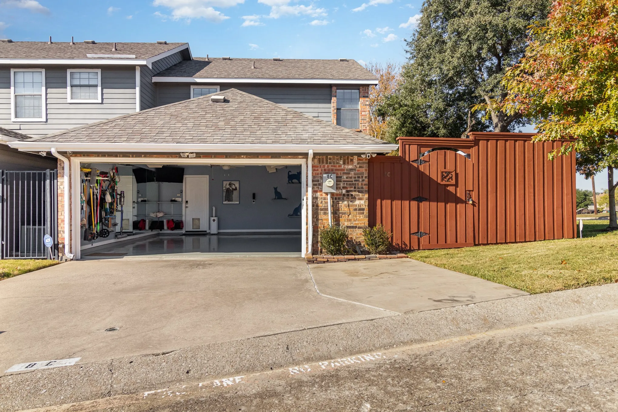 Inside garage there is extra storage (on left) and plenty of space for two cars in 20x20 area. Exterior lights and cameras convey.