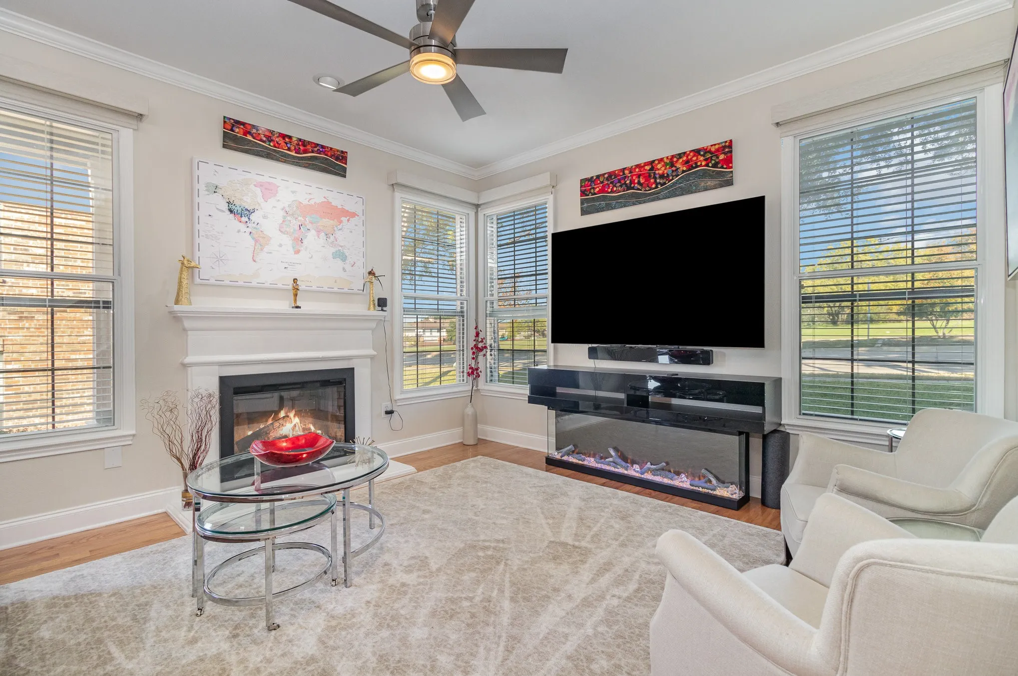 Remodeled first floor now offers an open floor plan with new wood flooring, multiple windows with electronic shades.
