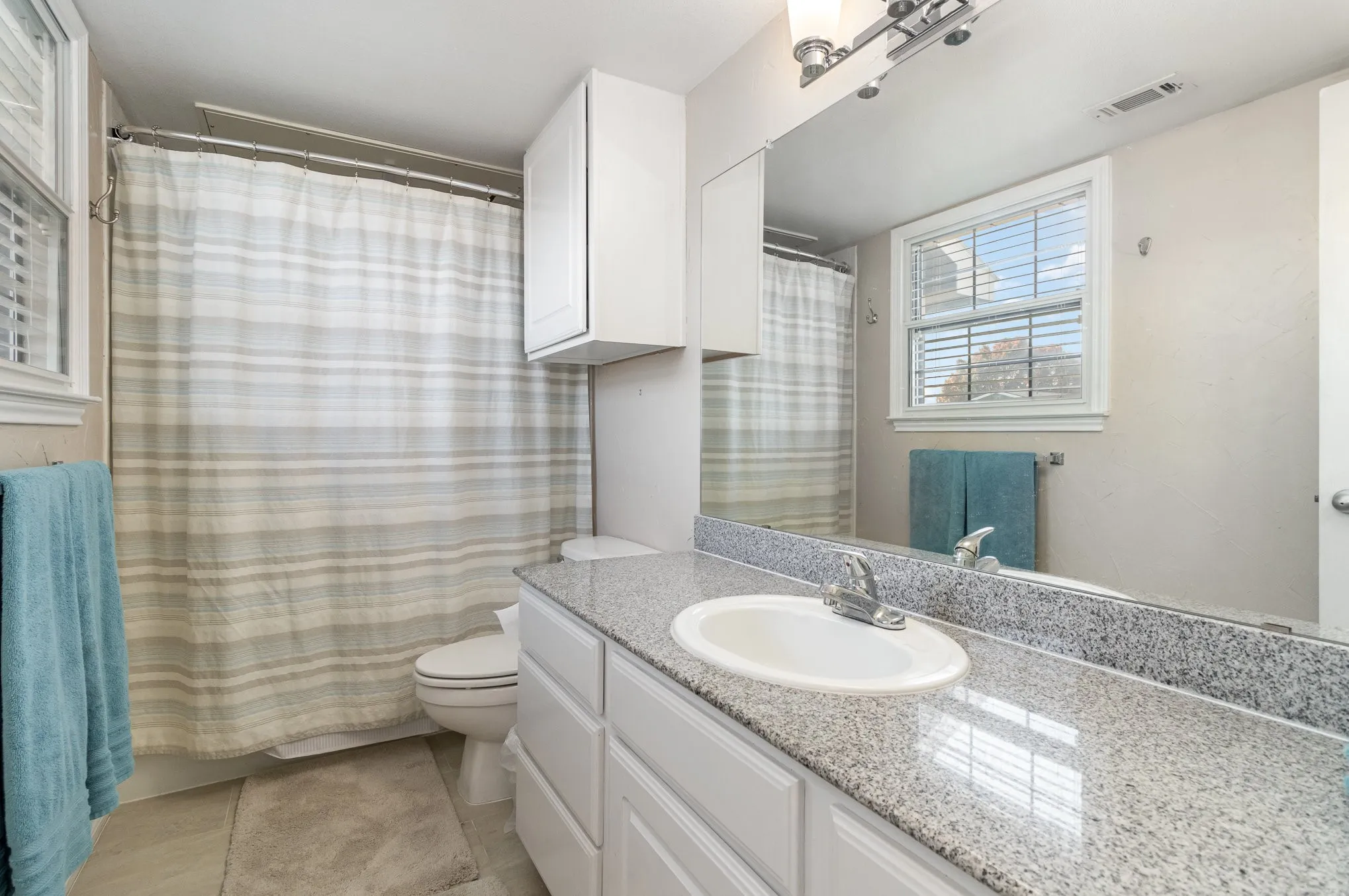 Full bath upstairs for secondary bedroom.