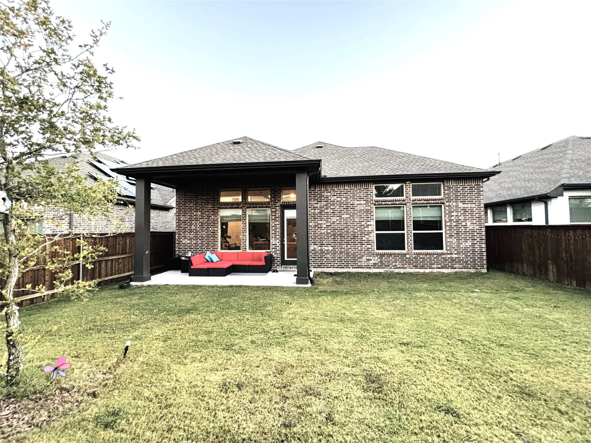 Rear view of property with a patio, a lawn, and an outdoor hangout area