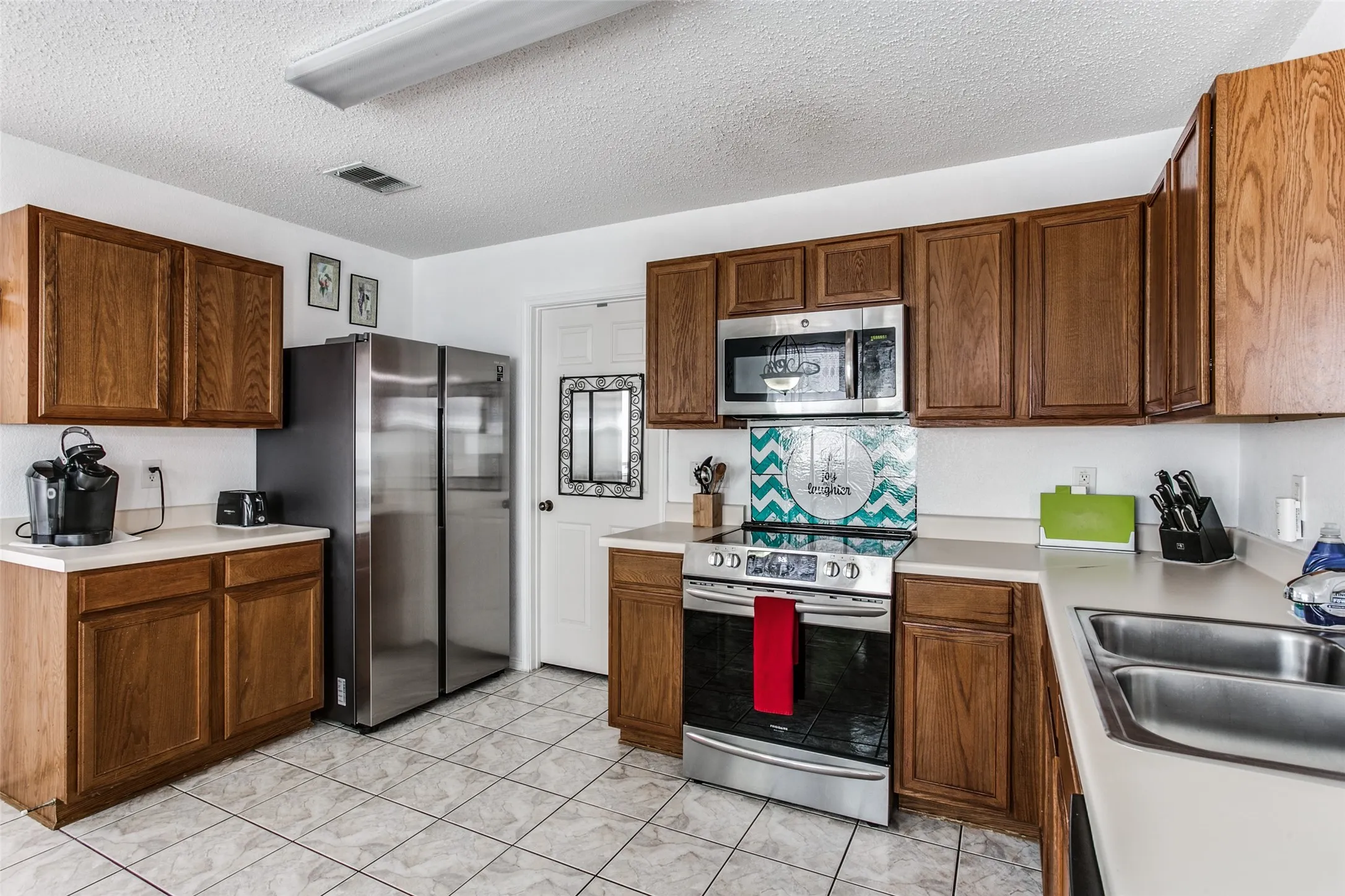 Previous photo of furnished and before flooring was updated.