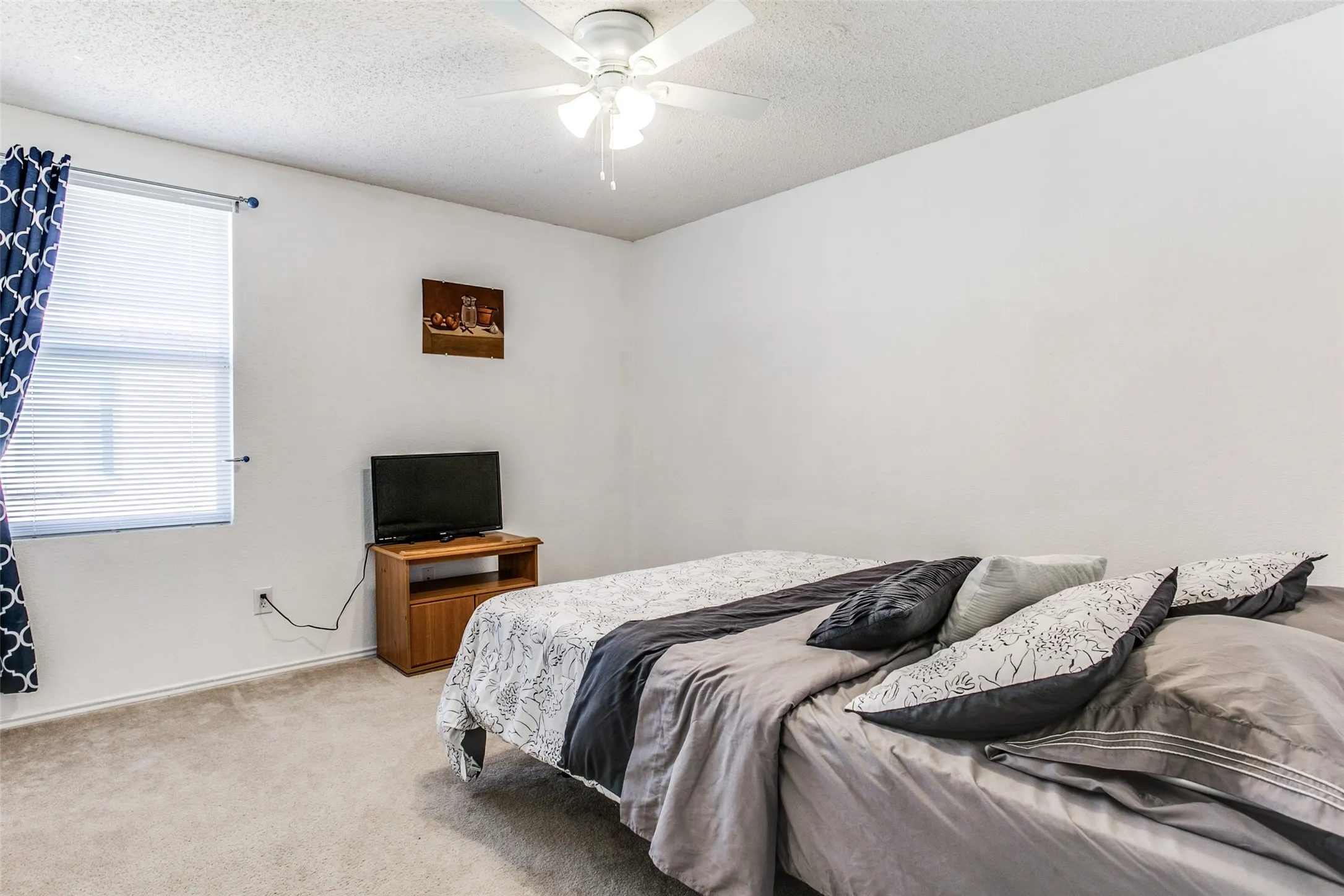 Previous photo of furnished and before flooring was updated.