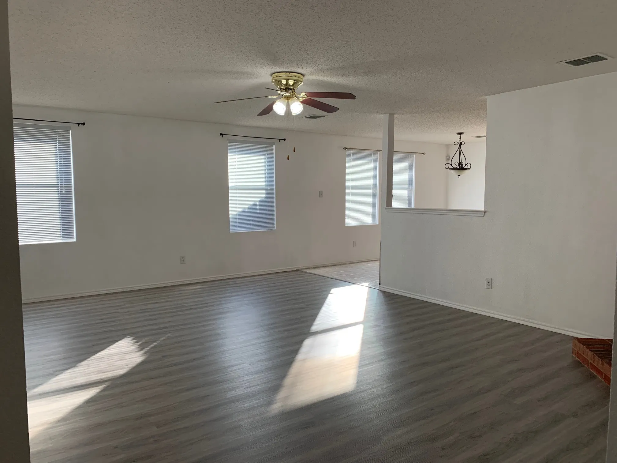 Updated photo of Luxury Vinyl Plank installed and no furnishings