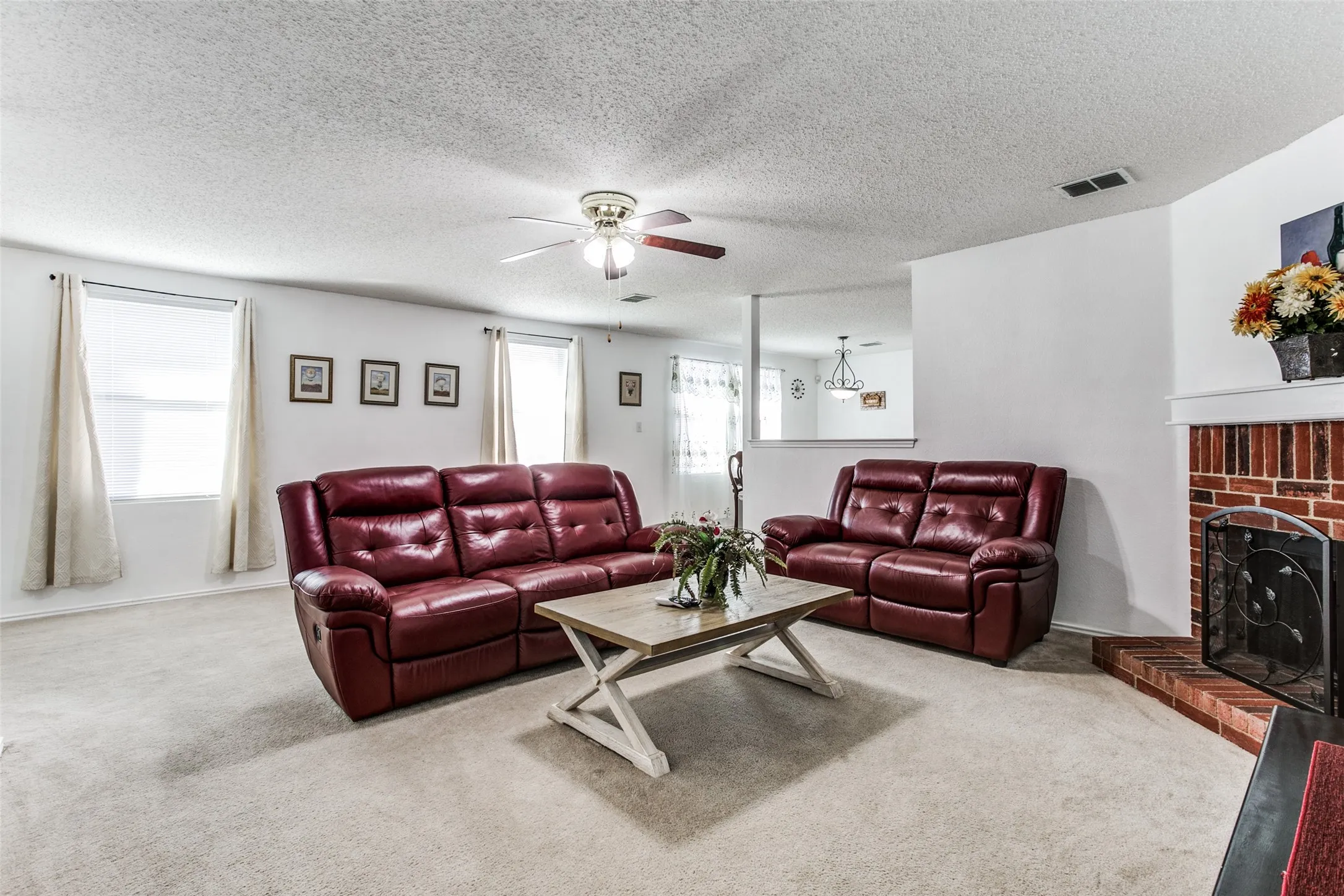 Previous photo of furnished and before flooring was updated.