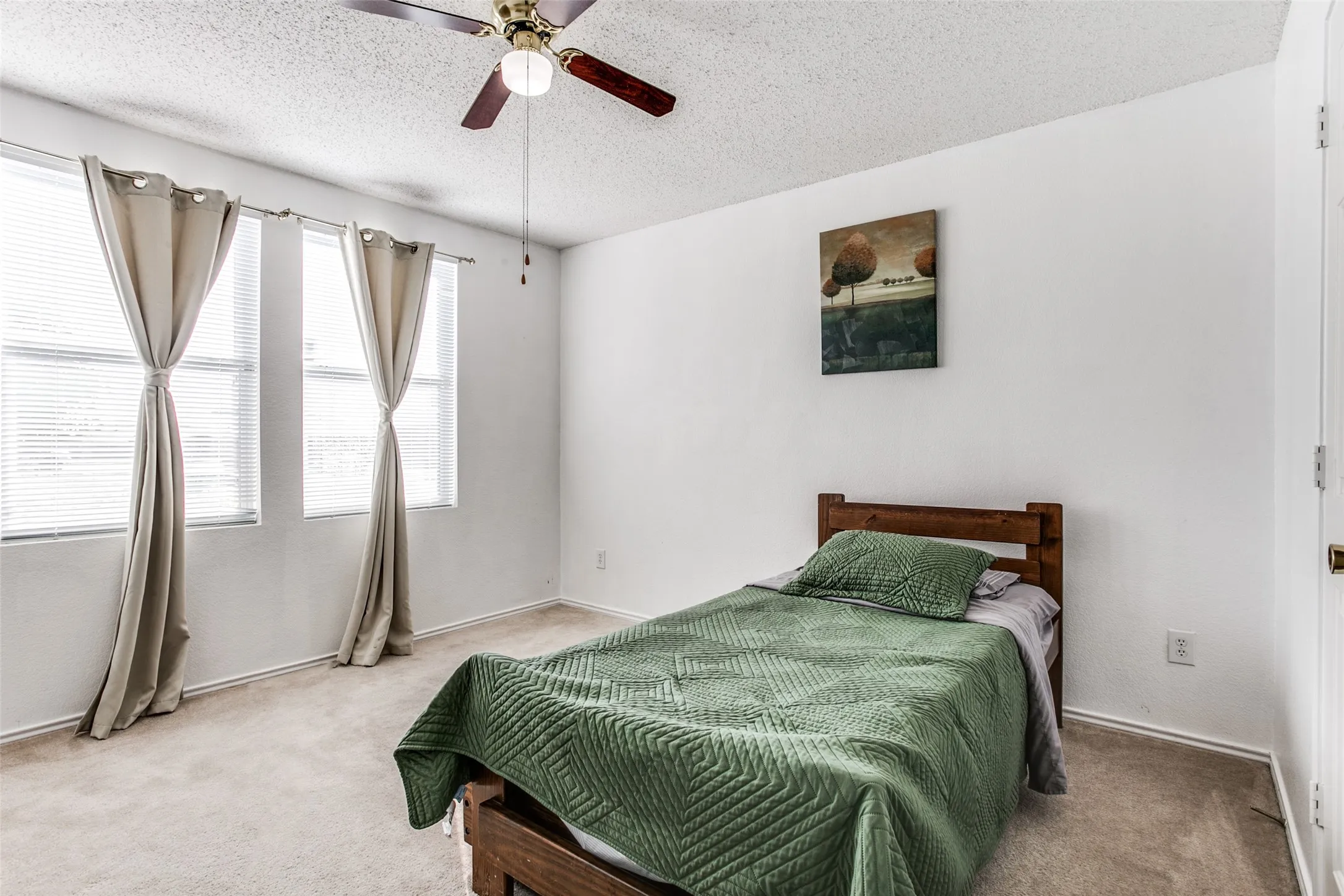 Previous photo of furnished and before flooring was updated.