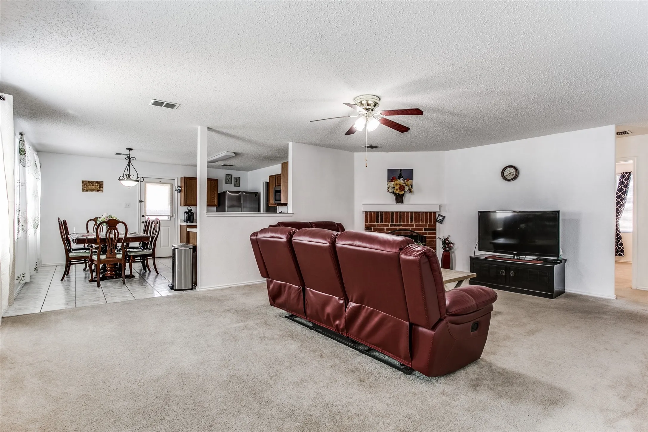 Previous photo of furnished and before flooring was updated.