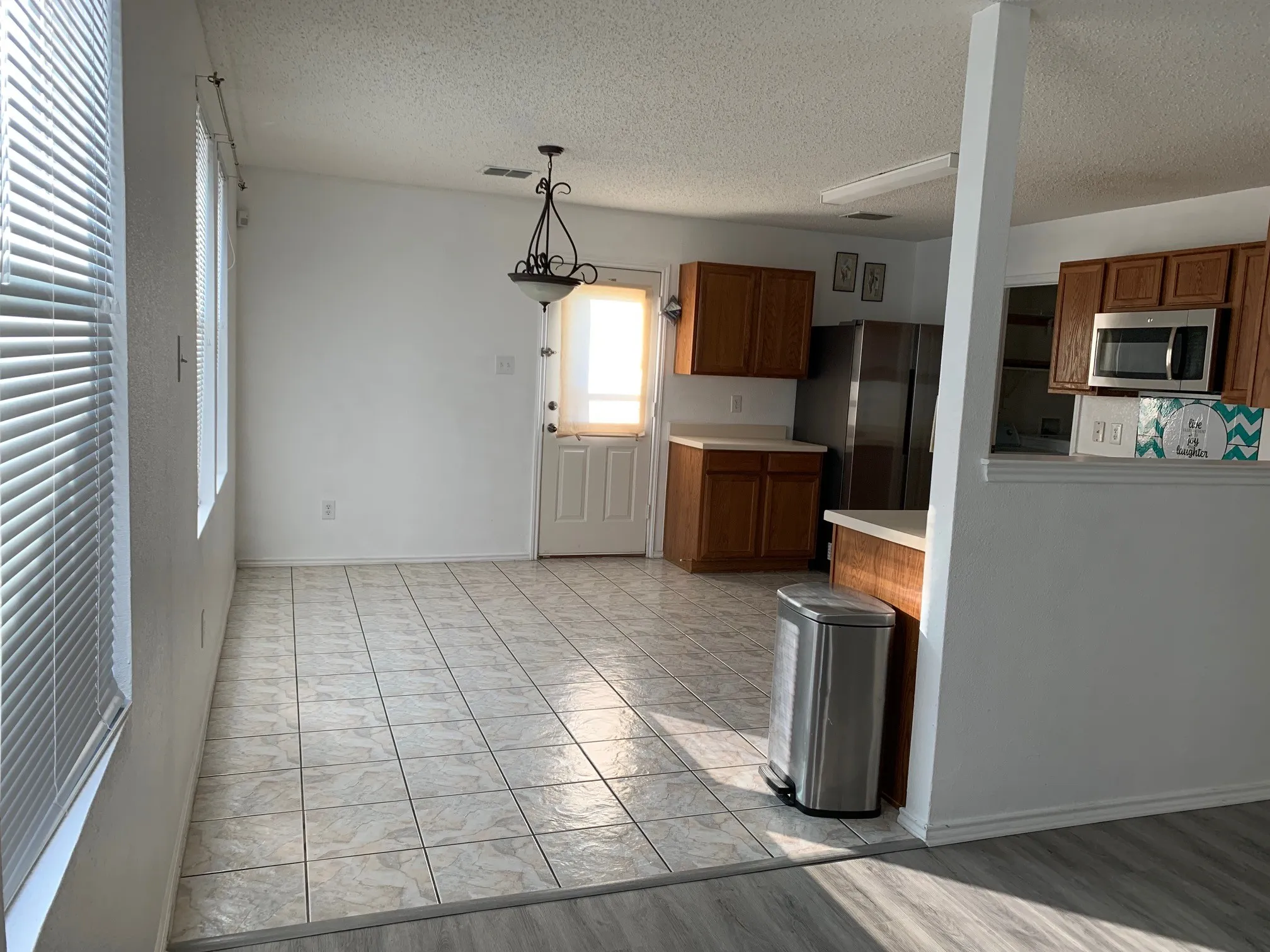 Updated photo of Luxury Vinyl Plank installed and no furnishings