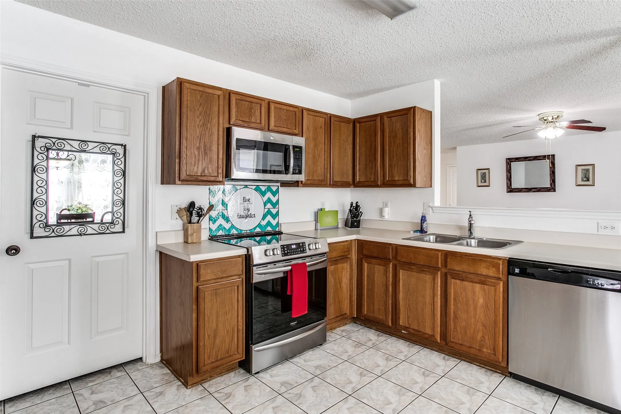 Previous photo of furnished and before flooring was updated.