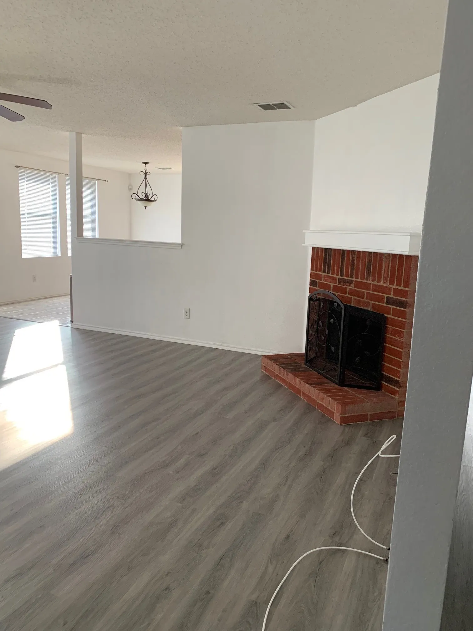 Updated photo of Luxury Vinyl Plank installed and no furnishings