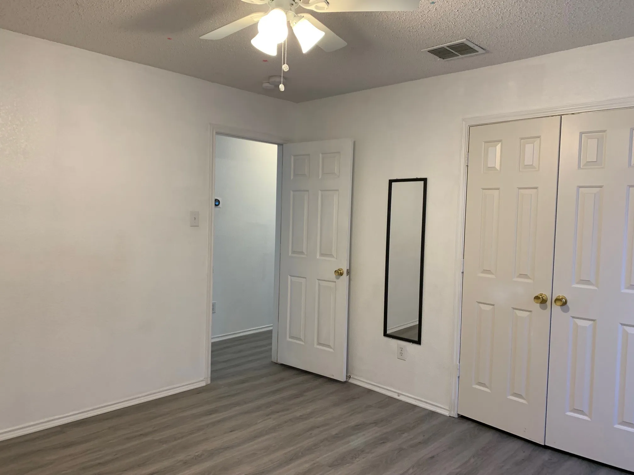 Updated photo of Luxury Vinyl Plank installed and no furnishings