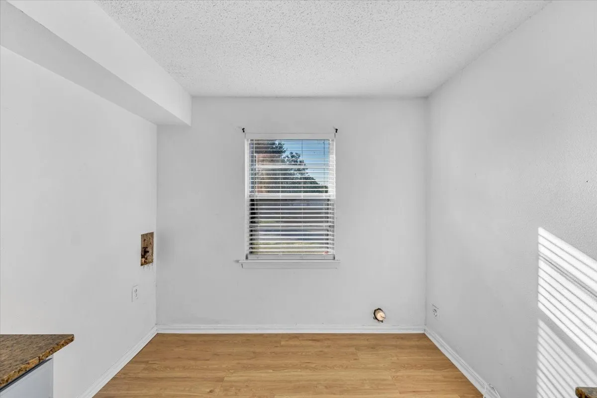 Wood-finish flooring with white walls