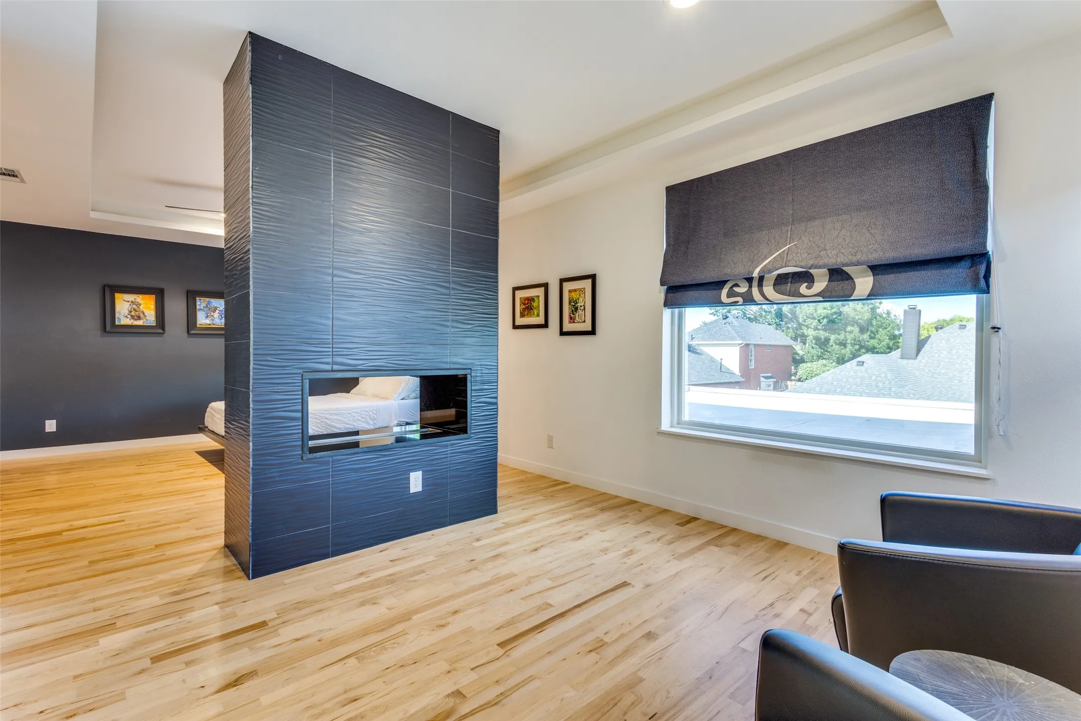 seating area& dual sided fireplace attached to the upstairs primary
