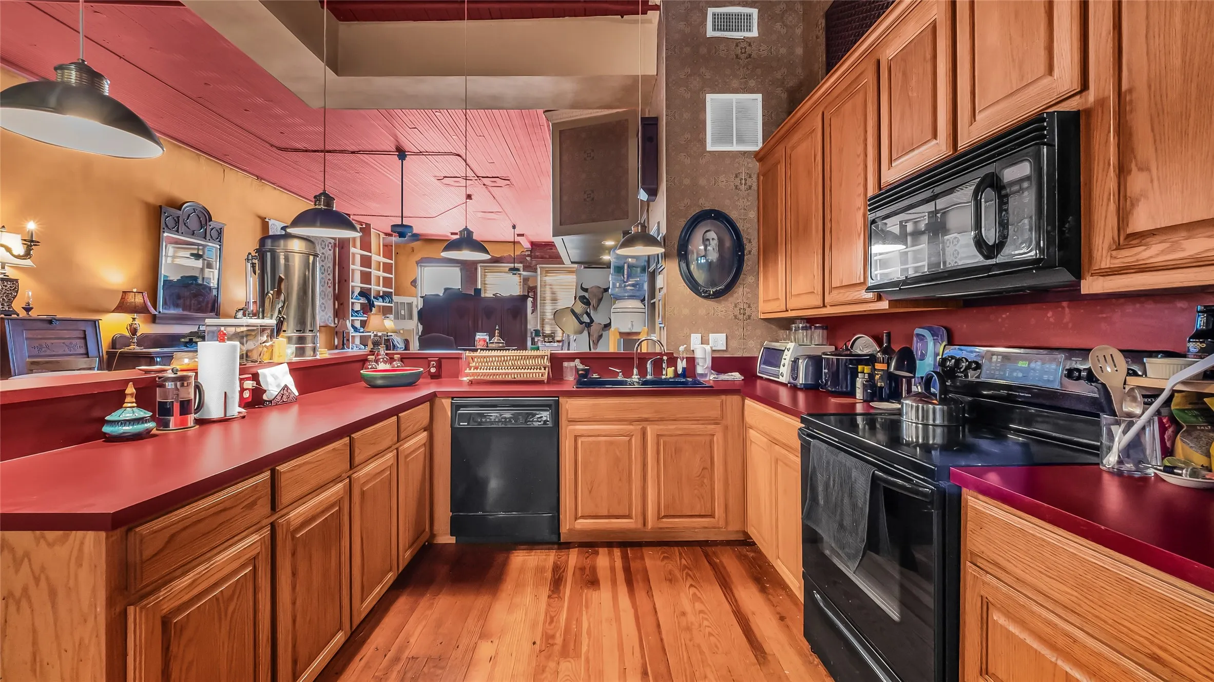 Wood-finish flooring with a U-shaped countertop configuration