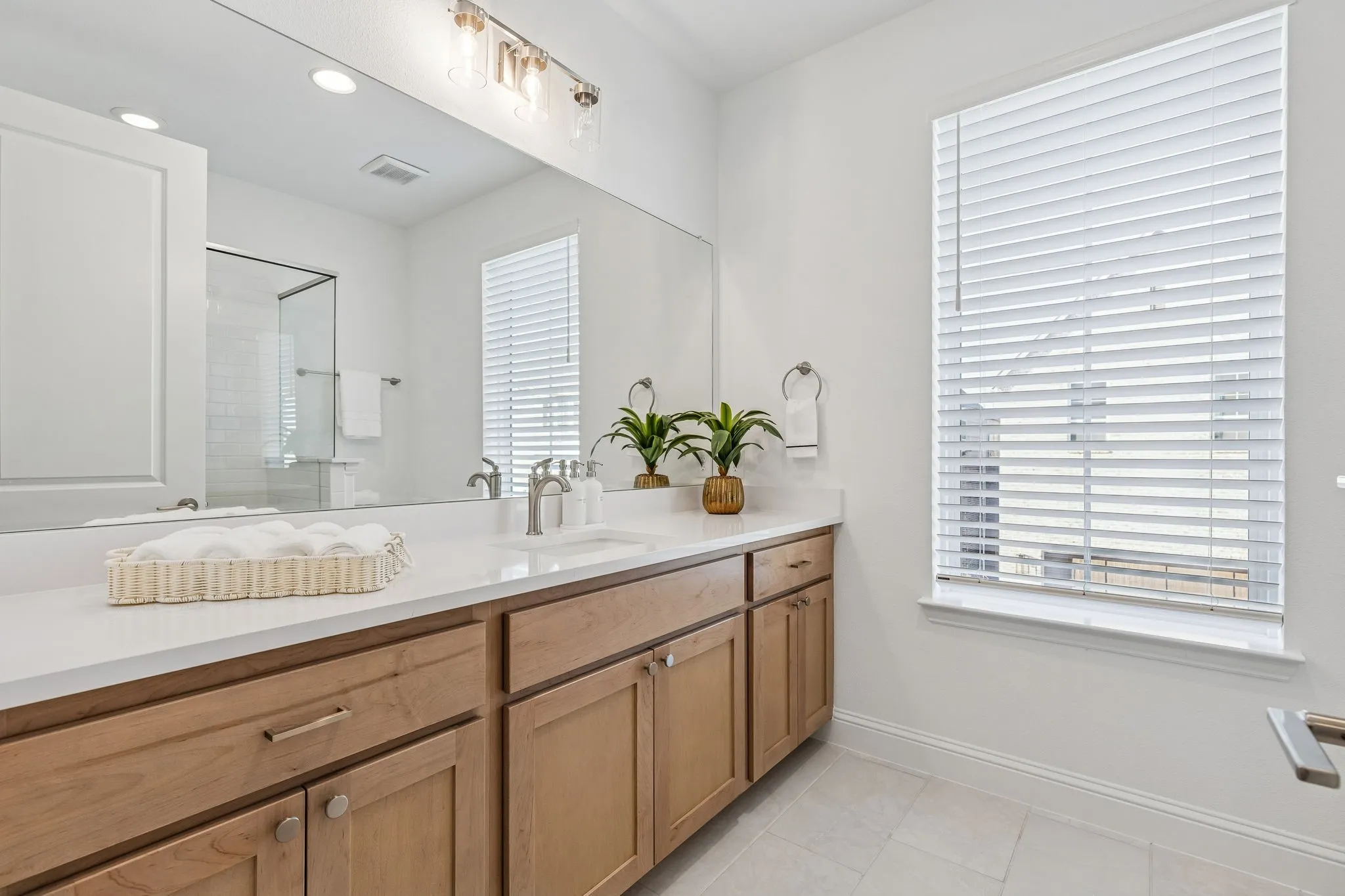 Light wood-finish vanity with ample storage