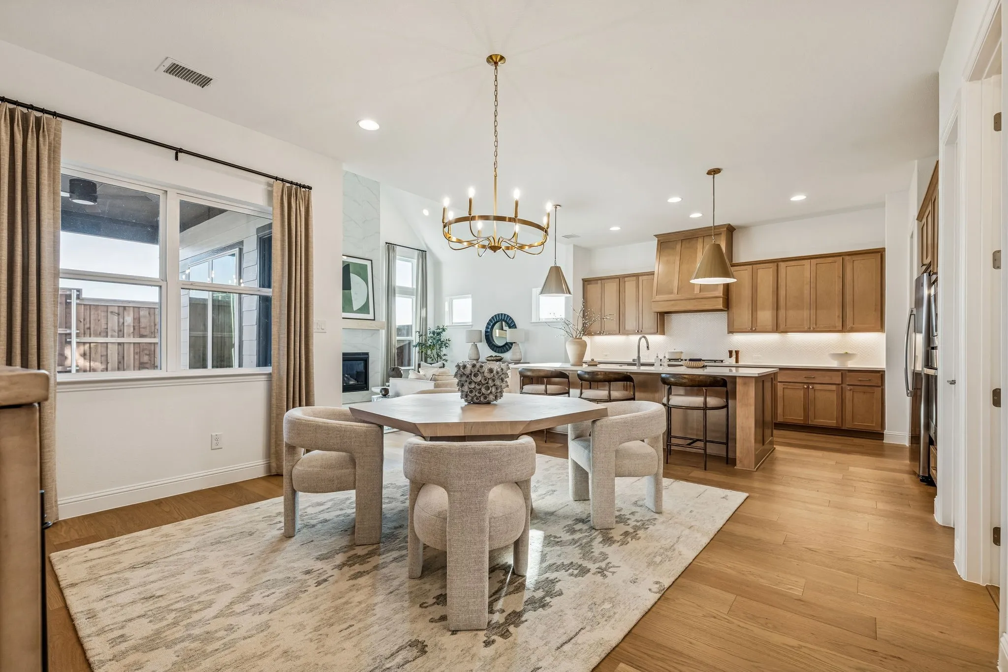 Open-concept living space with wood-finish flooring