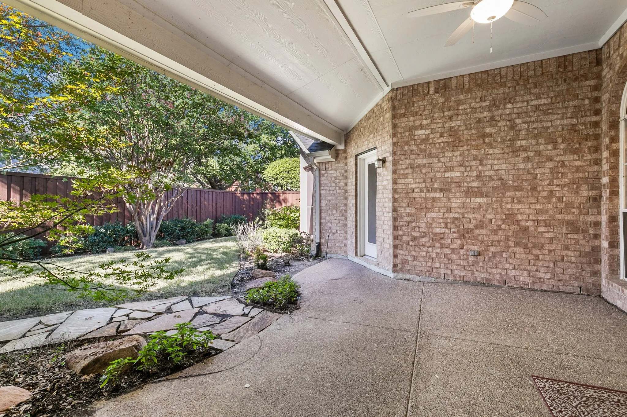 Large covered patio overlooking very private backyard