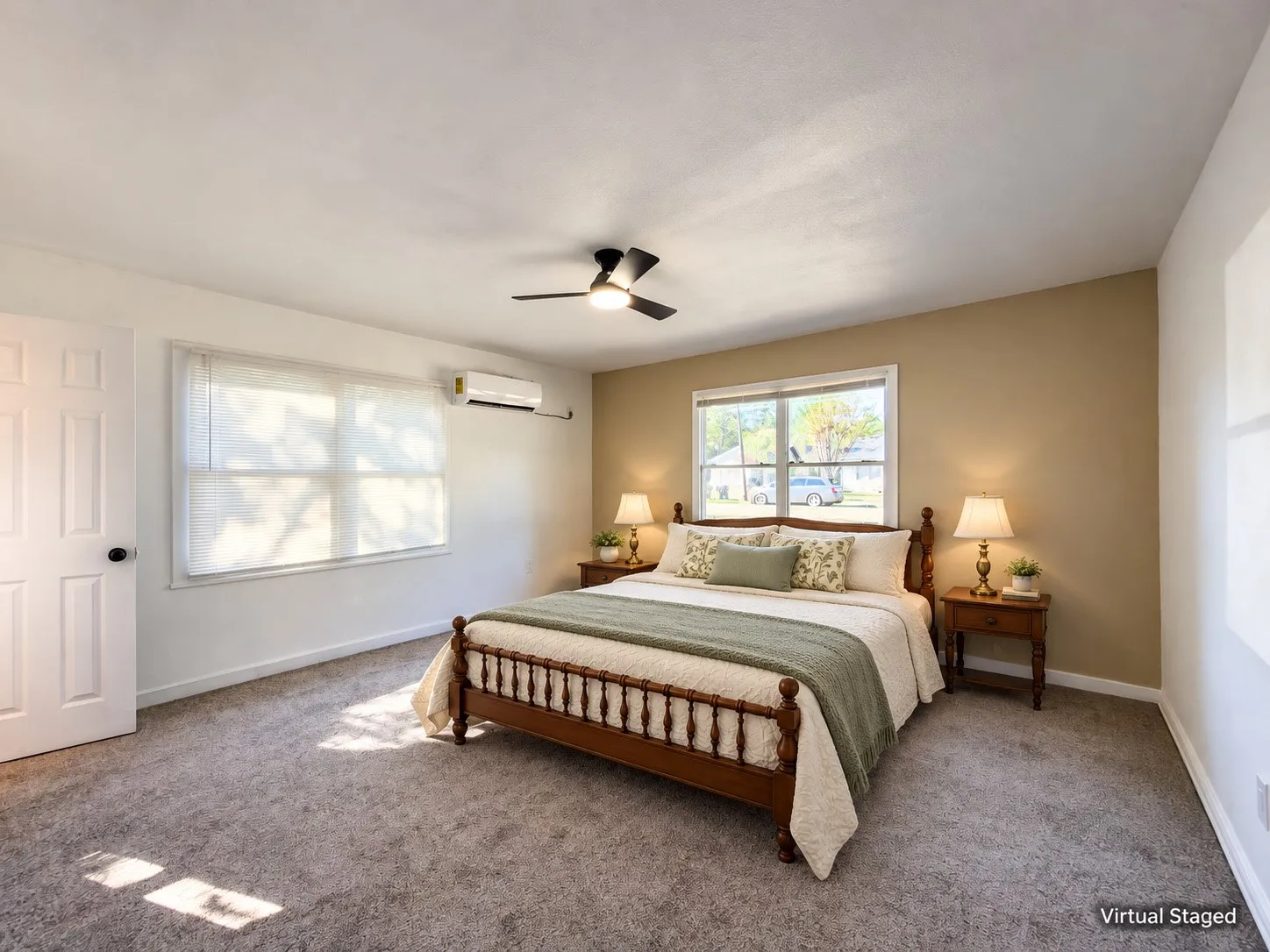 Plush carpeting with neutral wall tones and a ceiling fan