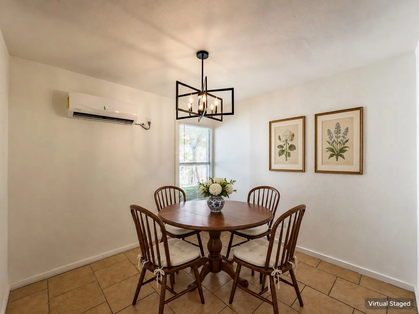 Tile flooring, white walls, black-finish geometric chandelier, window with exterior views, and a wall-mounted mini-split AC unit