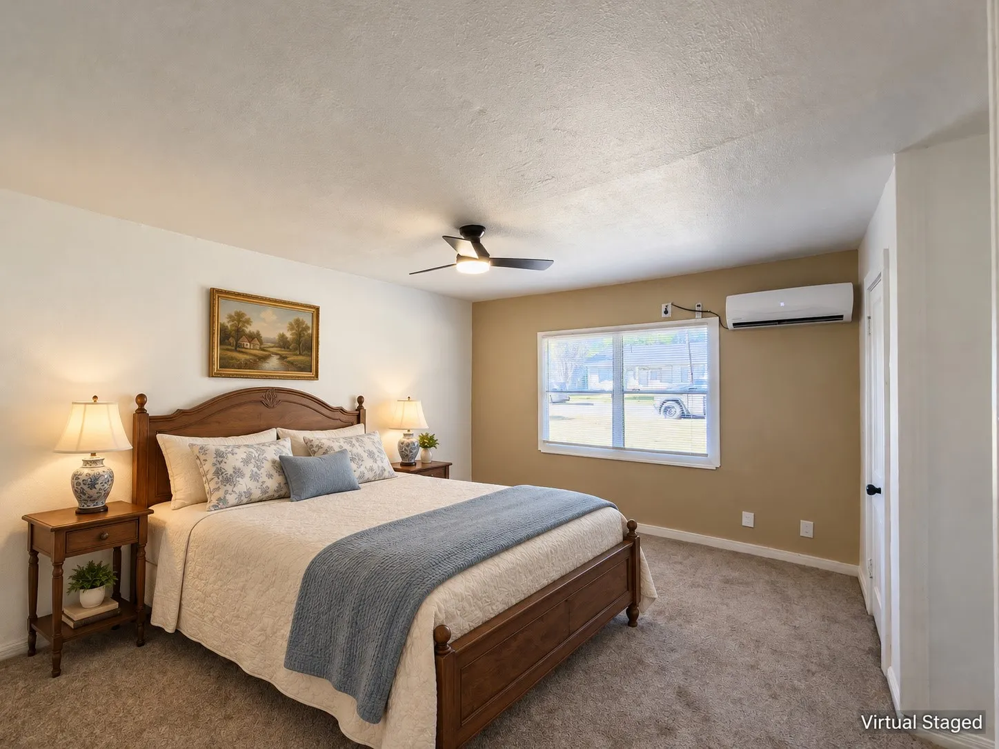 Carpeted room featuring a ceiling fan, window with white trim, and a wall-mounted air conditioning unit