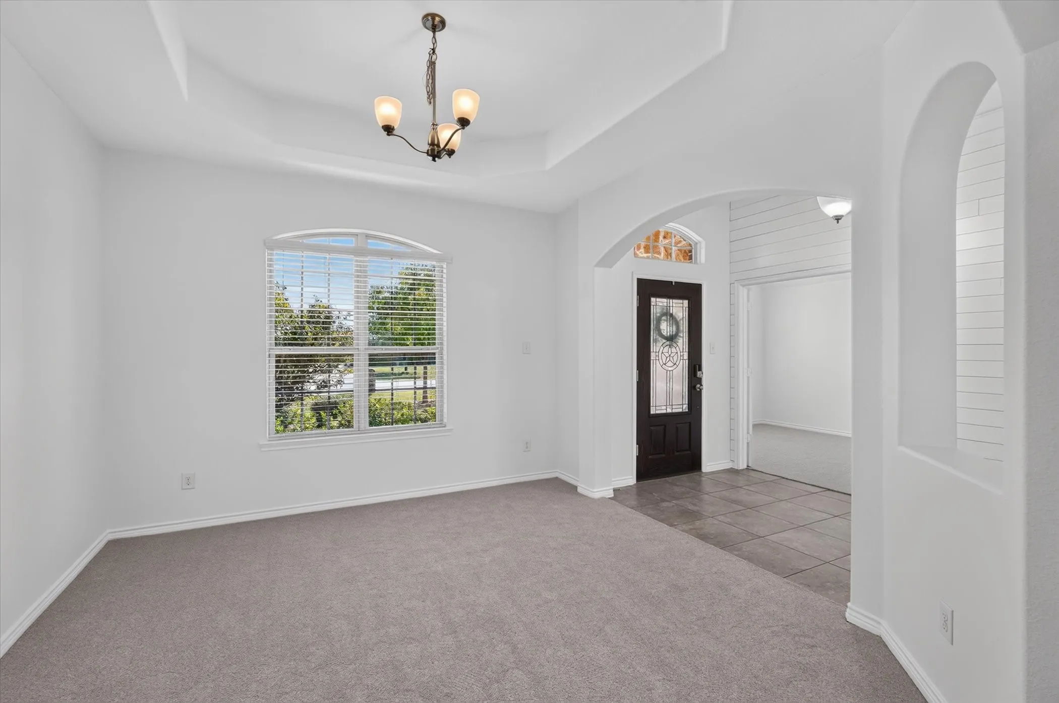 Tray ceiling with a decorative chandelier