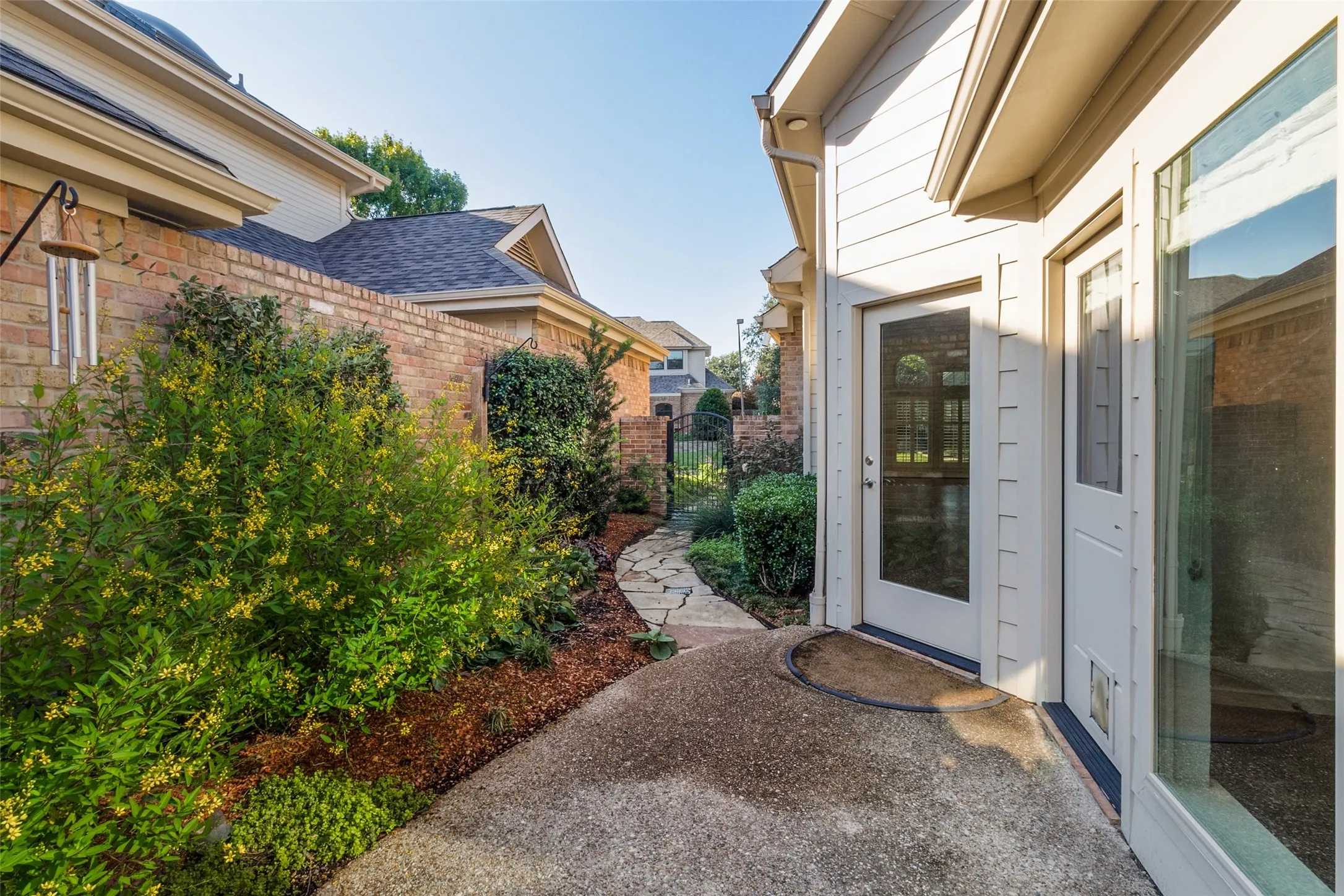 Patio and private sideyard off Primary and Family Room