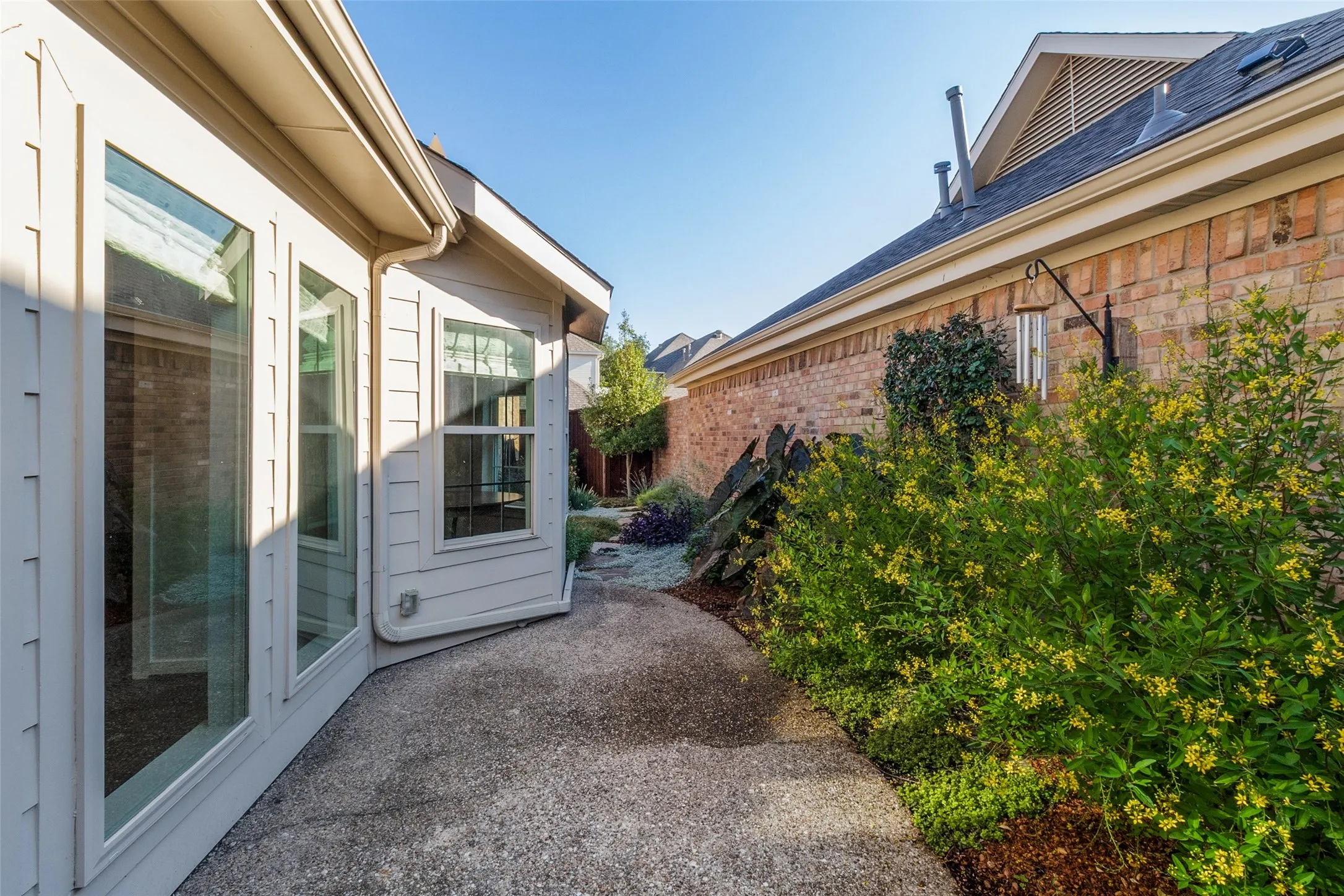 Patio and private sideyard off Primary and Family Room