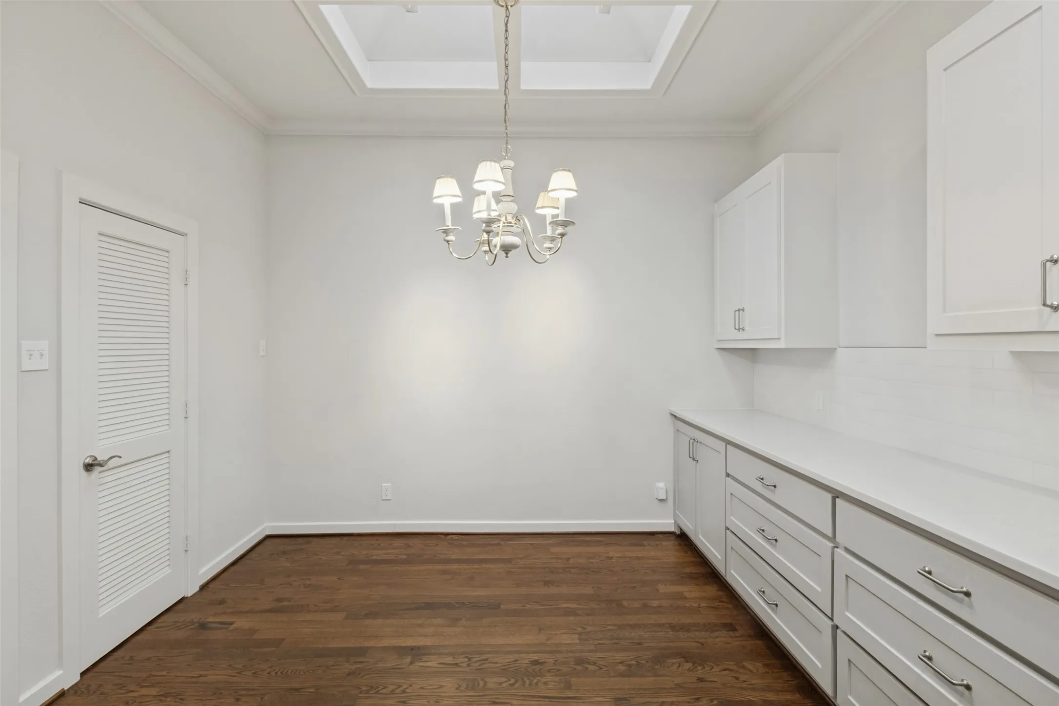 In back of open kitchen with adjacent walk-in pantry