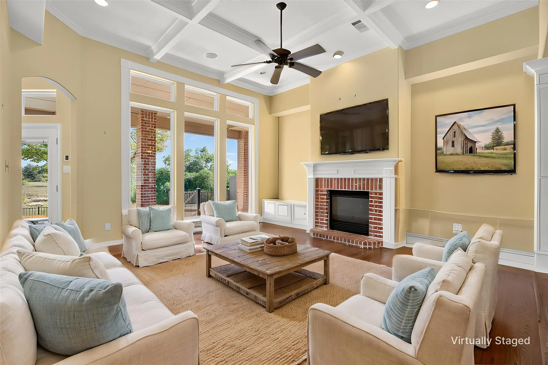 Floor-to-ceiling windows frame views where deer and wildlife wander right outside, setting the stage for peaceful mornings and porch-worthy evenings. Inside, soaring ceilings and a cozy fireplace welcome you into warm, inviting spaces made for gathering.