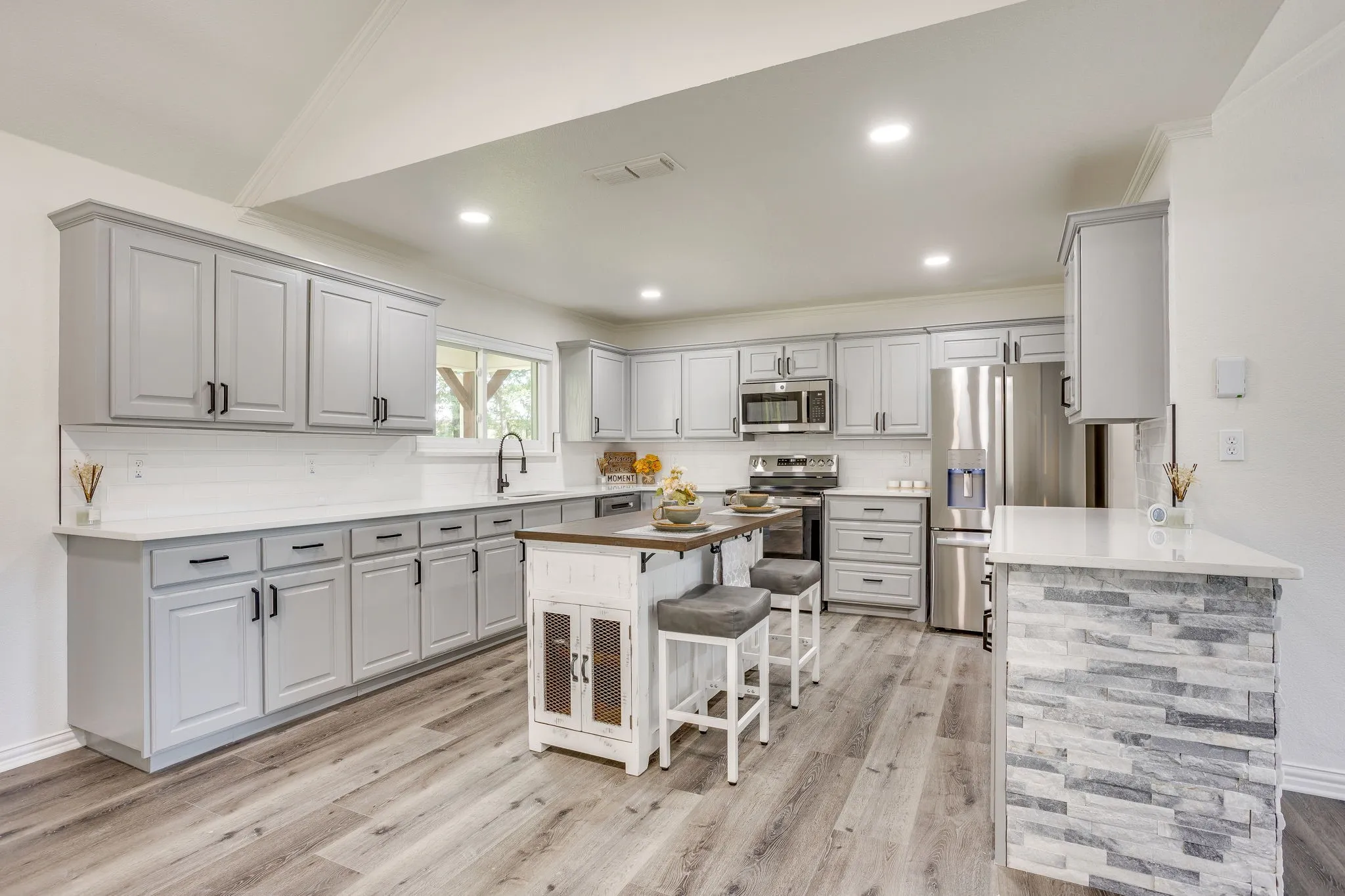 Cabinets galore with a pantry in this home!