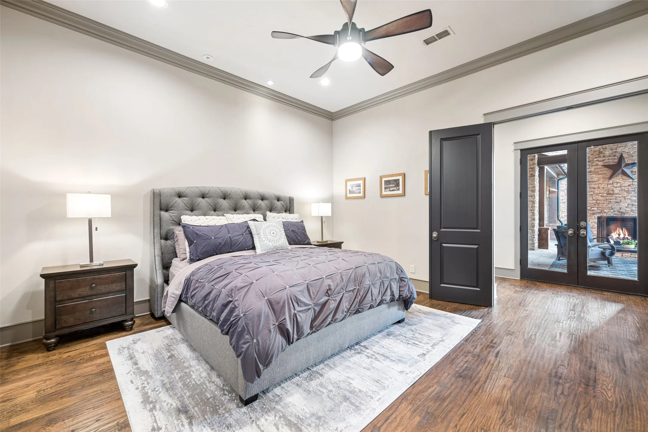 Large primary with easy access to the covered patio lounge.