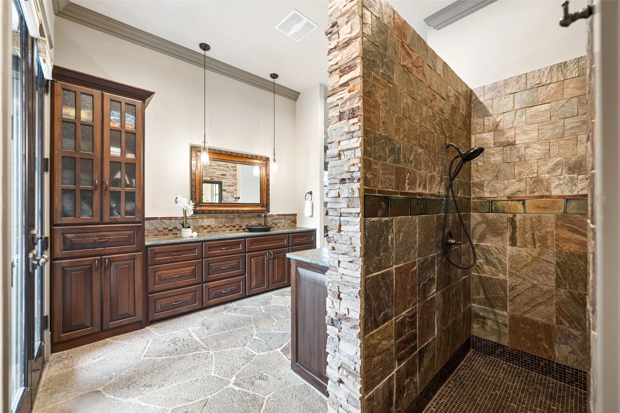 Stone walk-in shower is stunning.