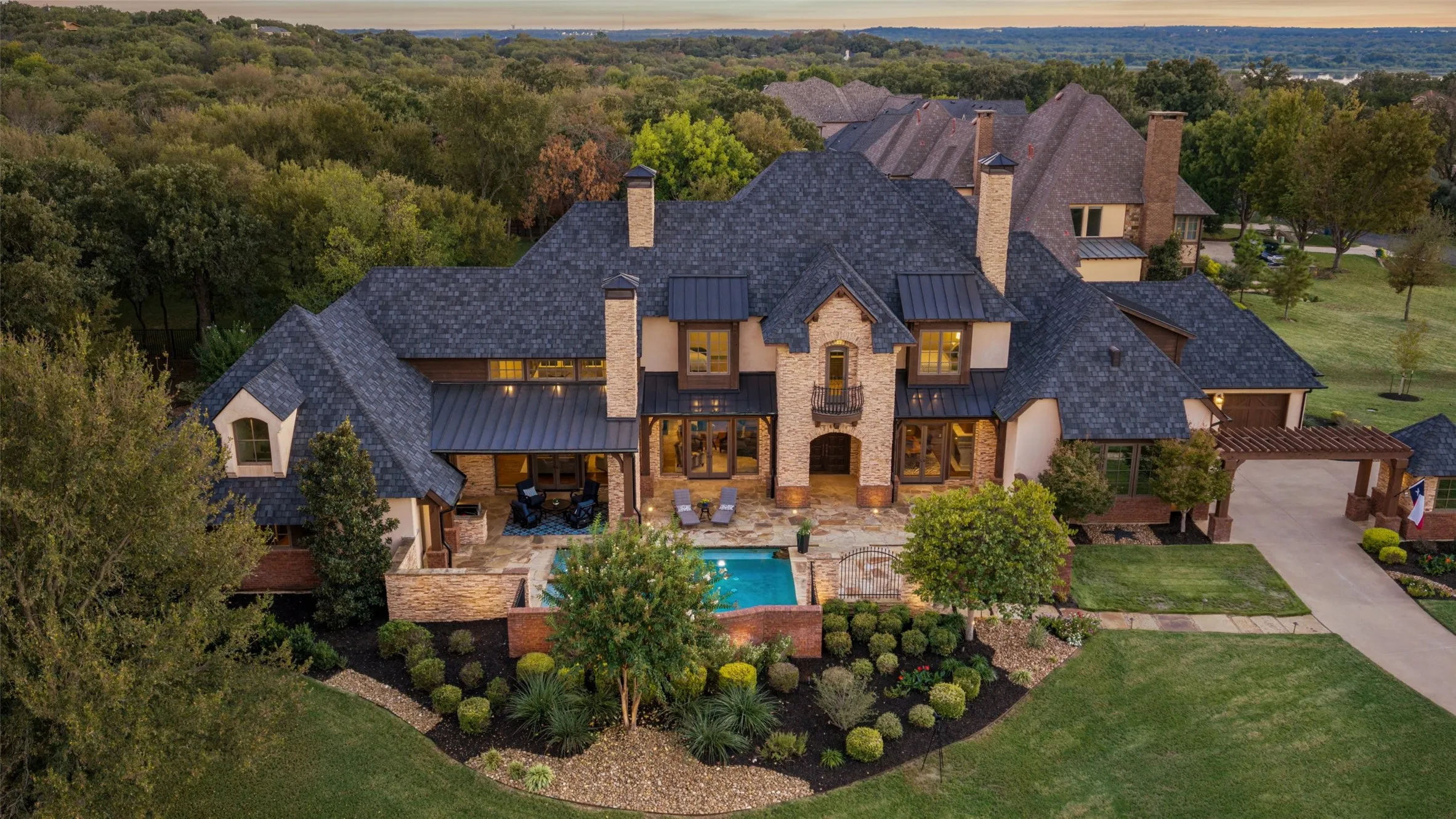 1-Acre estate with a private, gated front courtyard plaza with a sparkling pool and flagstone terrace creates a dramatic, resort-style entrance!