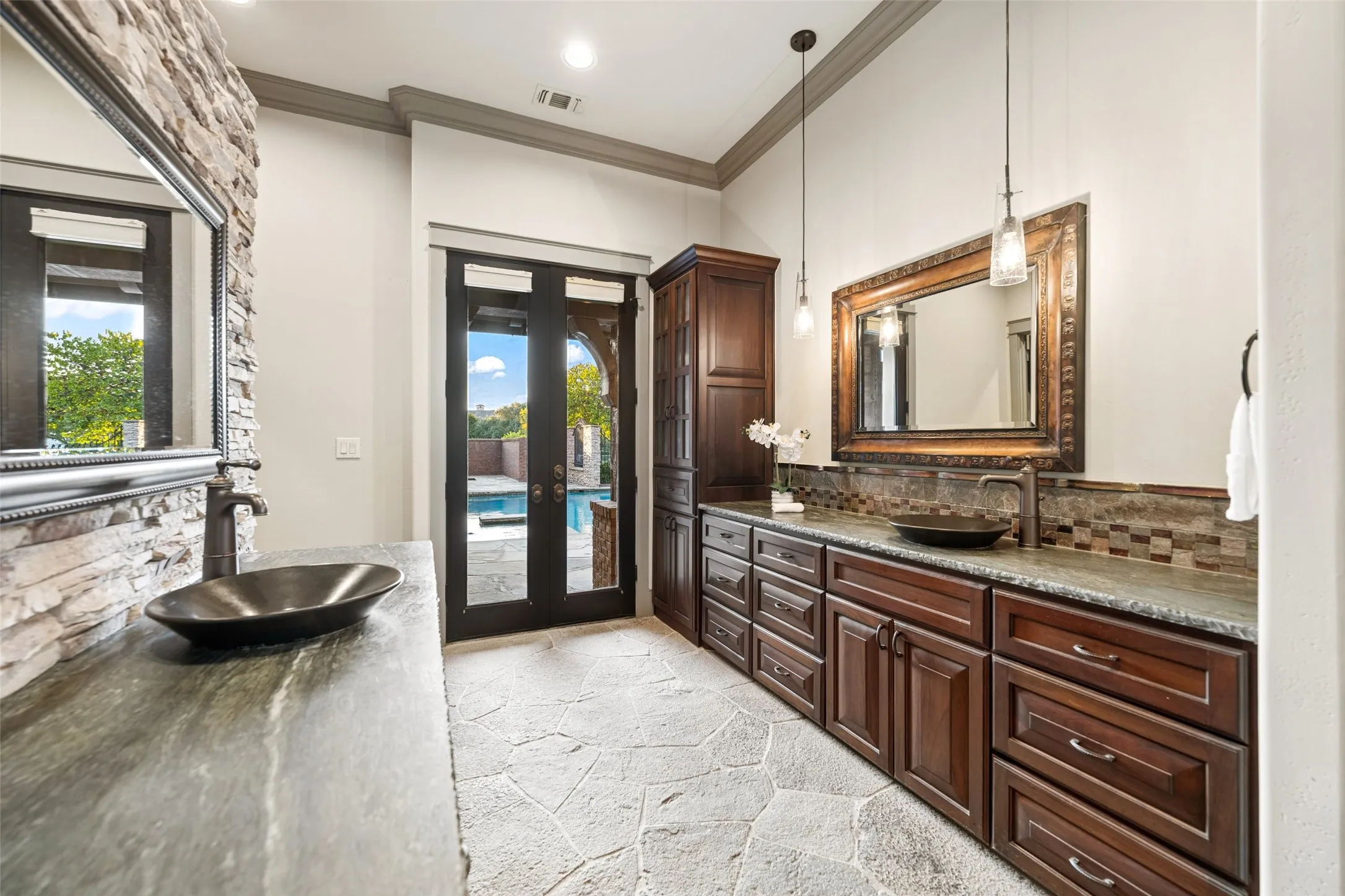 Double vanities and custom cabinets and so much storage.