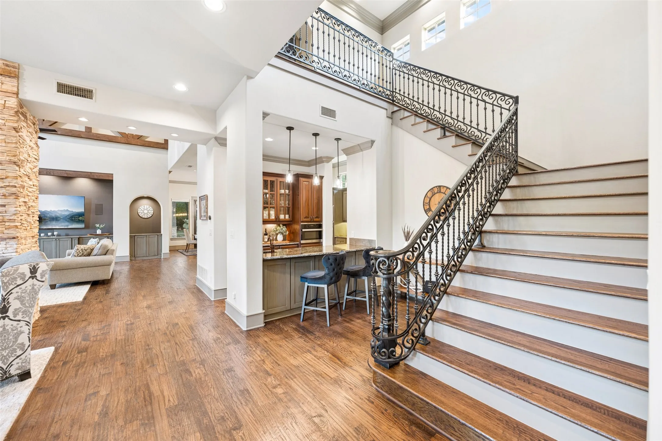 Custom wrought-iron railing with ornate scrollwork and twisted balusters