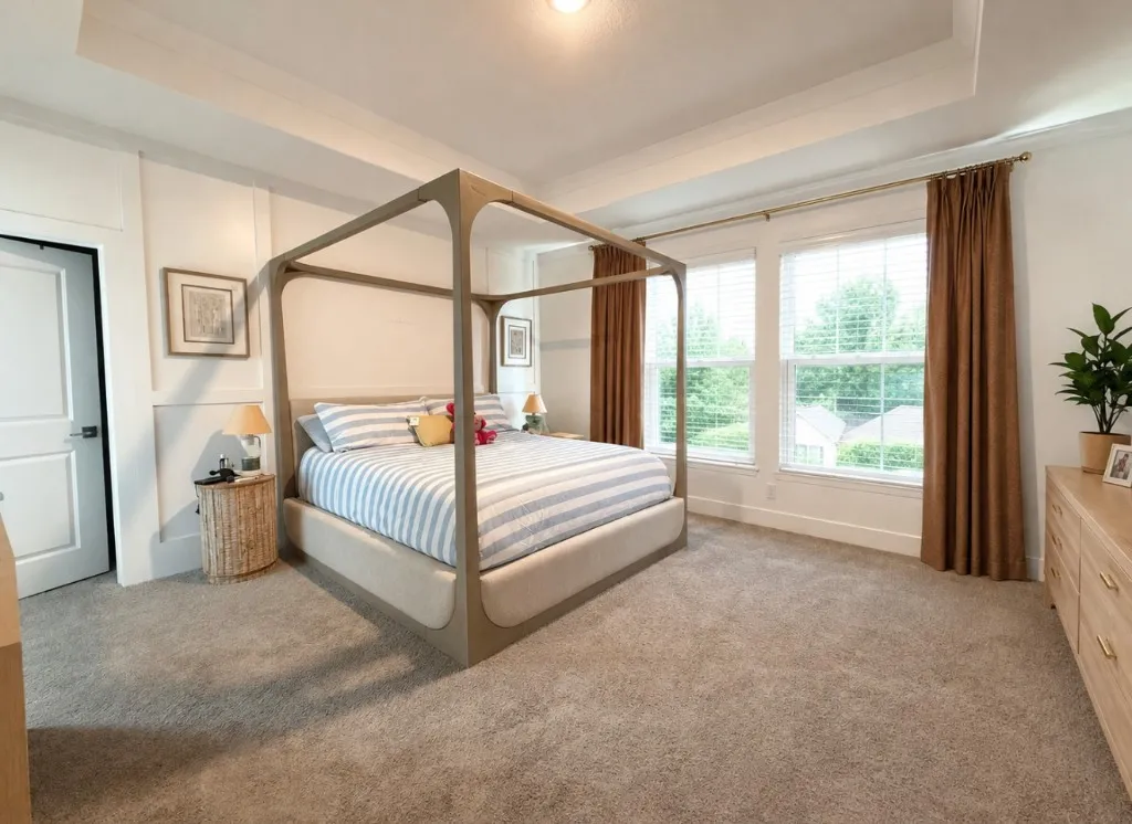Recessed ceiling with molding, wall paneling, dual windows, and carpeted flooring