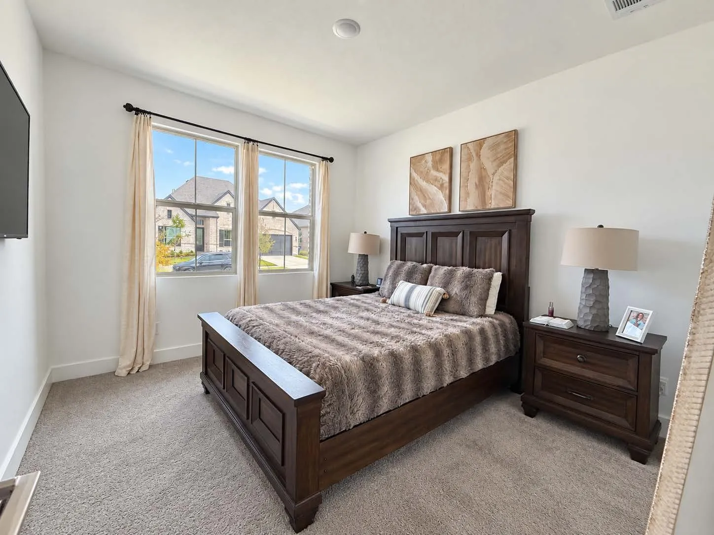 Carpeted flooring, white wall paint, dual windows with curtain rods, and recessed lighting