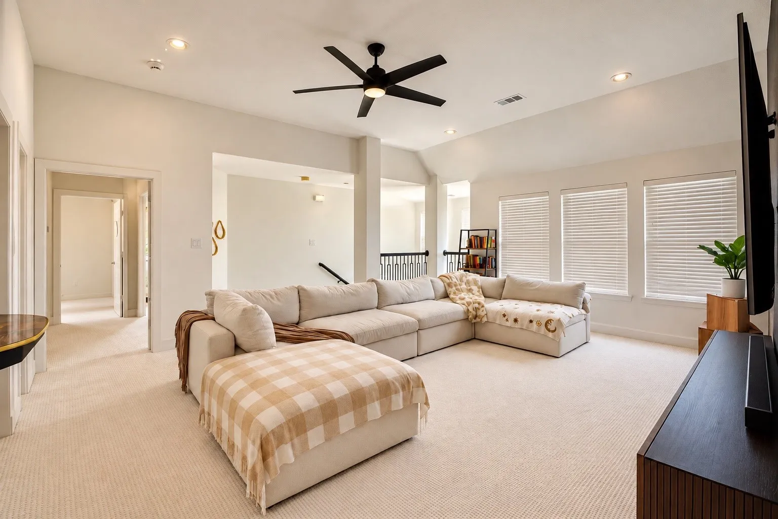 Vaulted ceiling with a black ceiling fan, recessed lighting, carpet flooring, and multiple windows with blinds