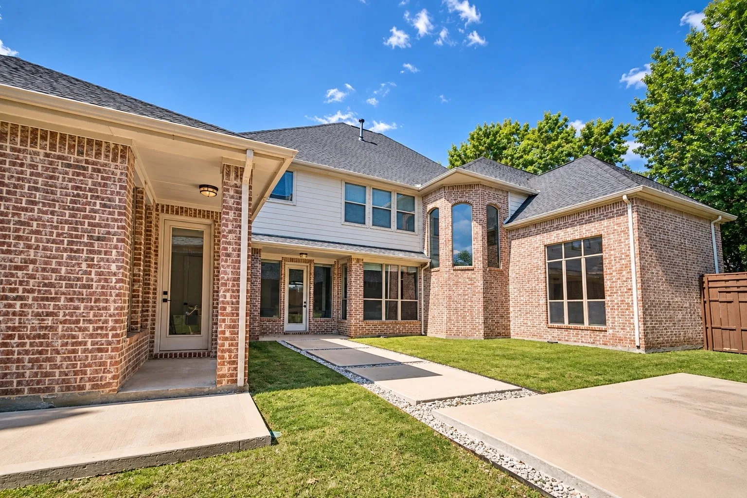 Brick exterior with a dark-pitched roof