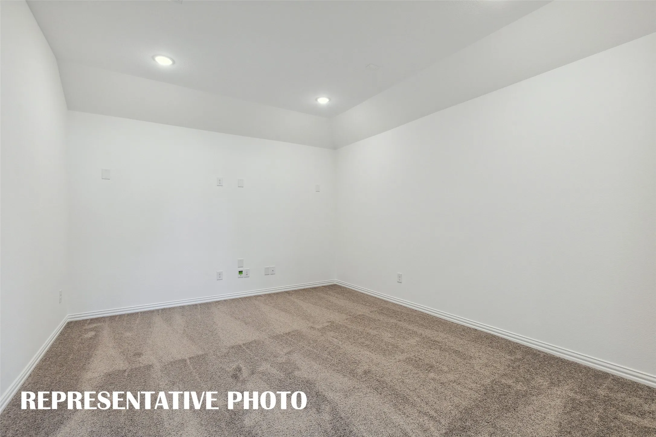 This spacious media room, paired with the adjacent game room, creates the ultimate family entertainment zone!  REPRESENTATIVE PHOTO