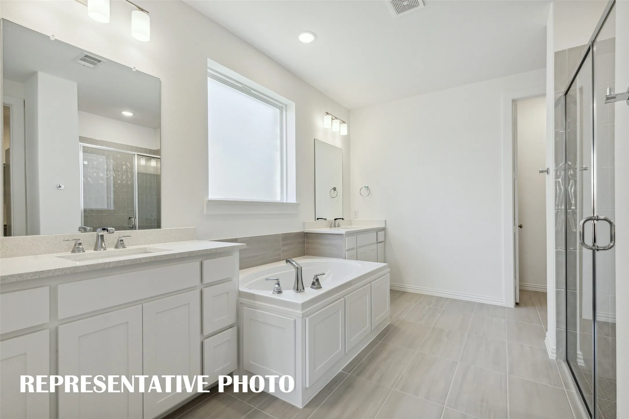 Plenty of room for two in this wonderful owner's bath!  REPRESENTATIVE PHOTO